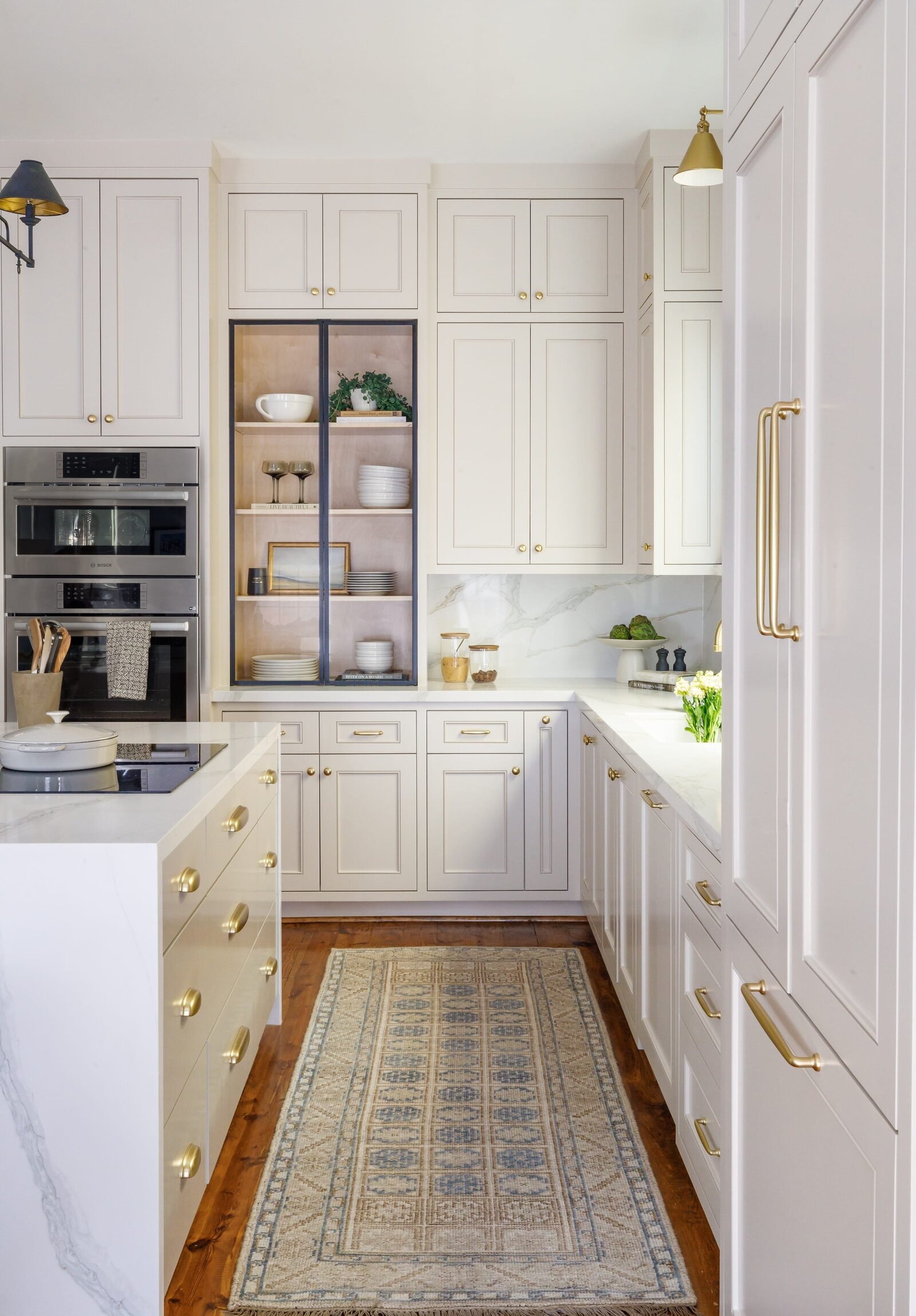 vision and hammer kitchen with runner rug and white cabinets