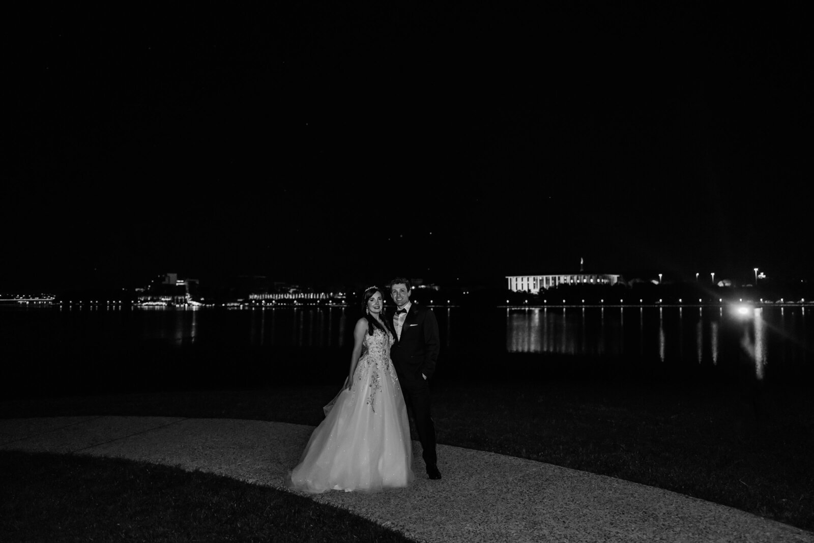 Night time weddingphoto with the Canberra light in the background