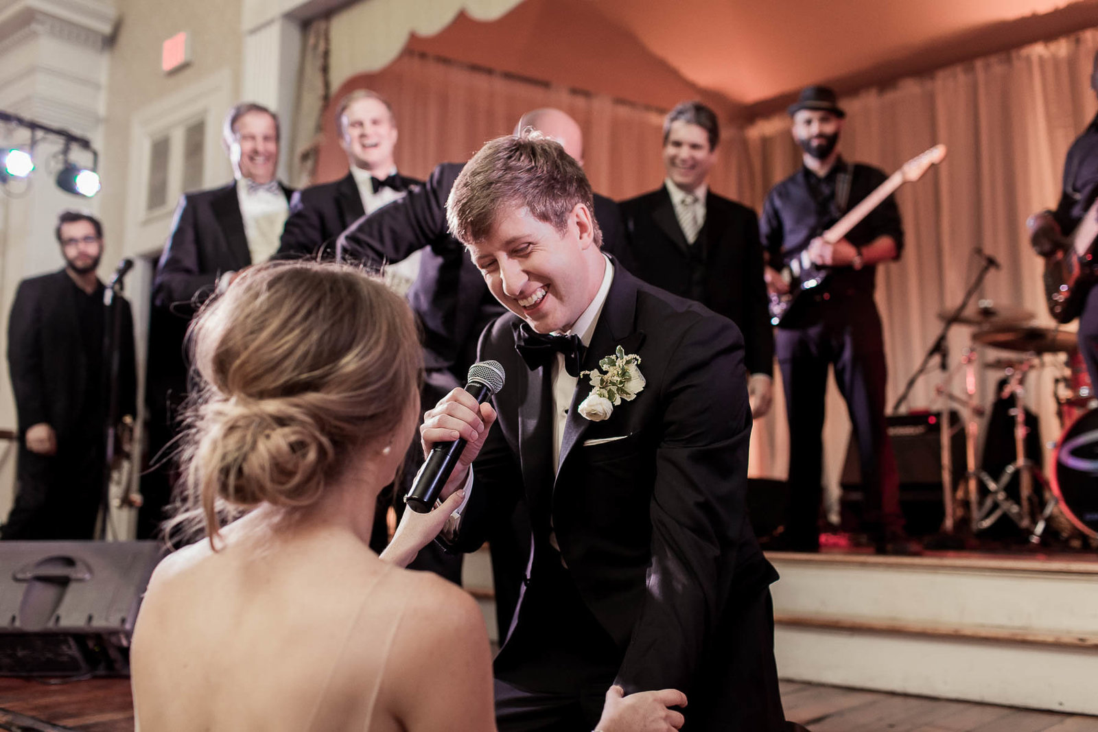 Groom gets pulled up on stage and sings to bride, Hibernian Hall, Charleston, South Carolina