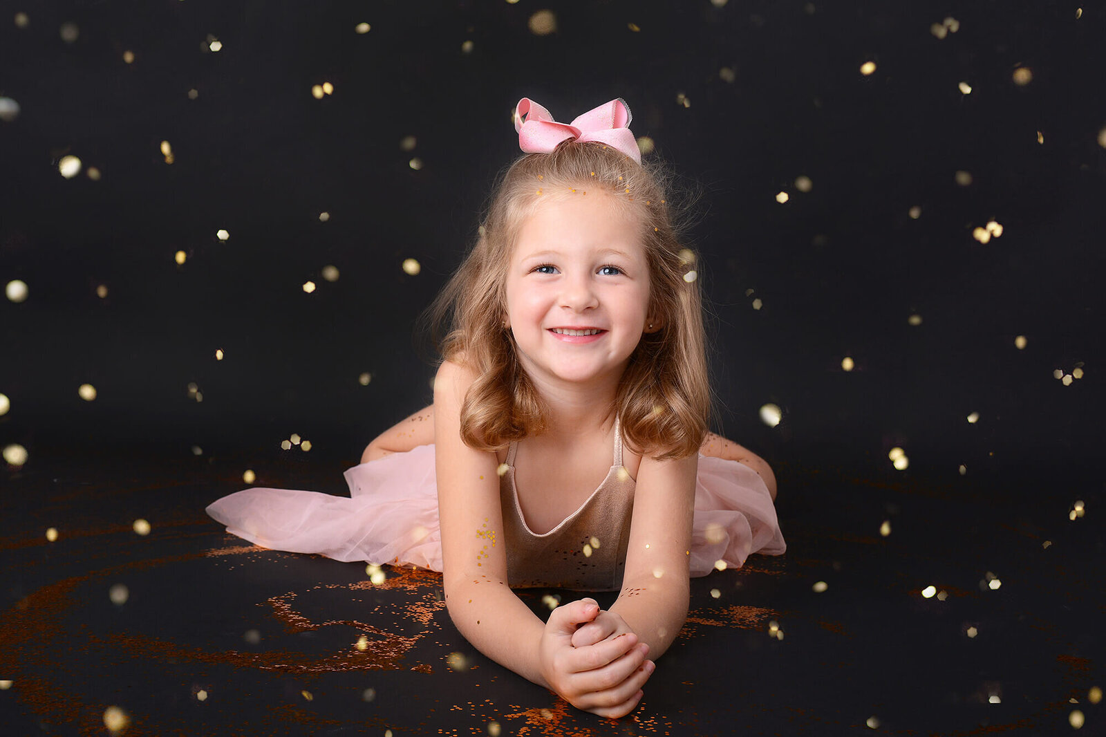 girl smiles at her glitter photoshoot in houston