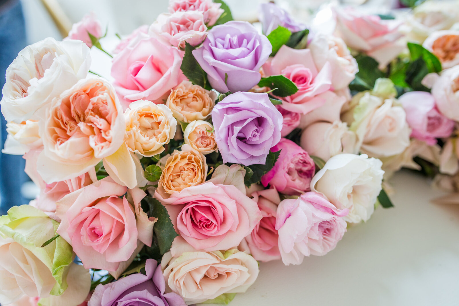 shades of purple, coral, pink and white florals in bouquet