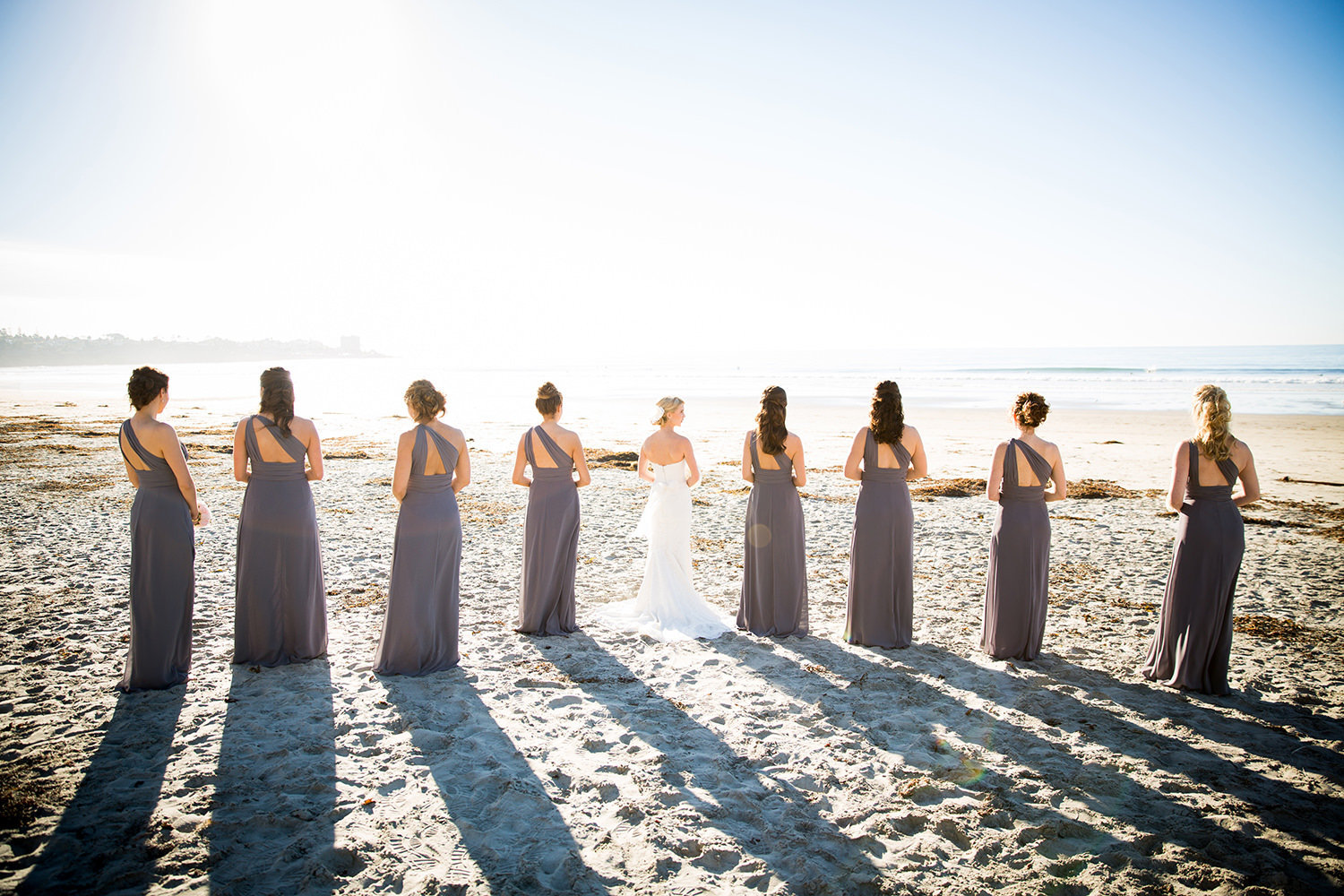 bridesmaids walking on beach