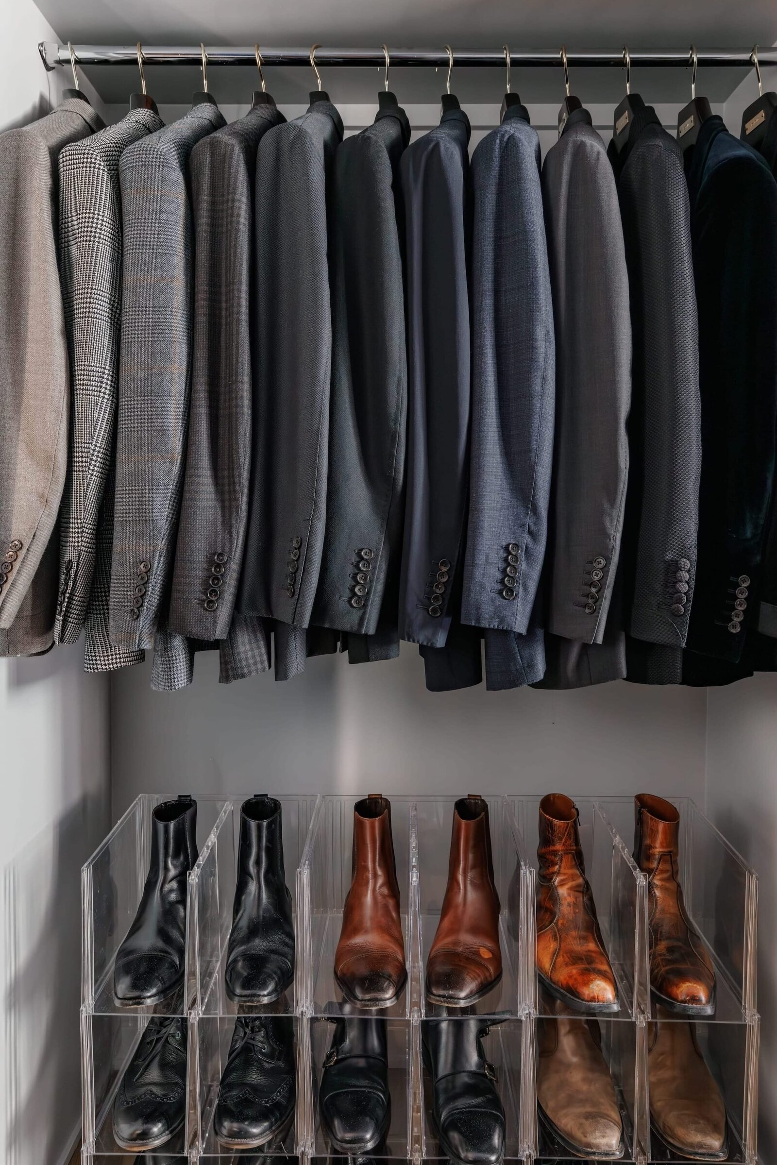vision and hammer organizing mens closet with hanging suits and shoes