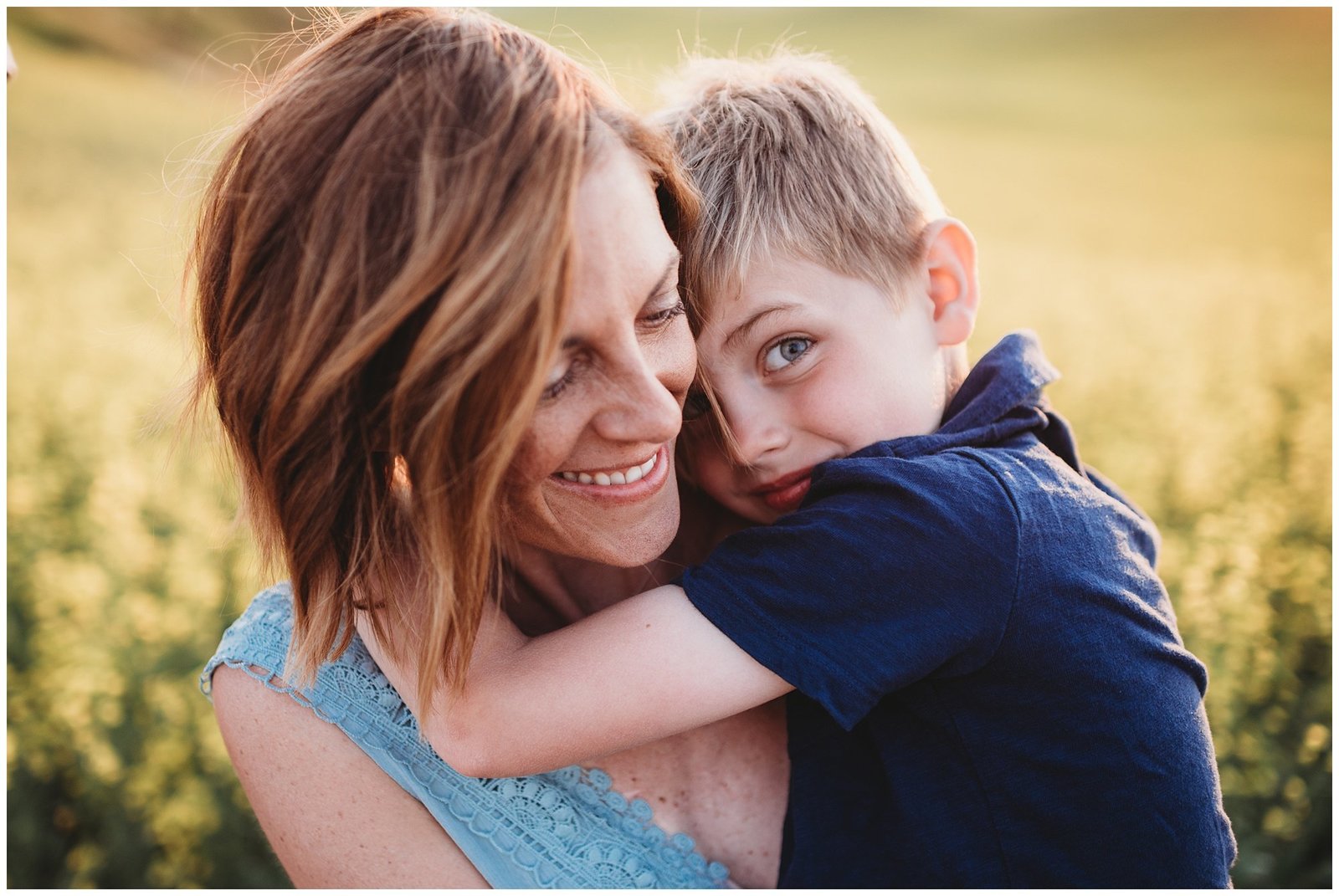 little boy hugging mom in field at sunset Emily Ann Photography Seattle Family Photographer