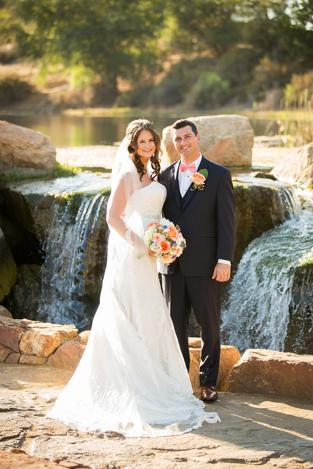 bride and groom with water fall