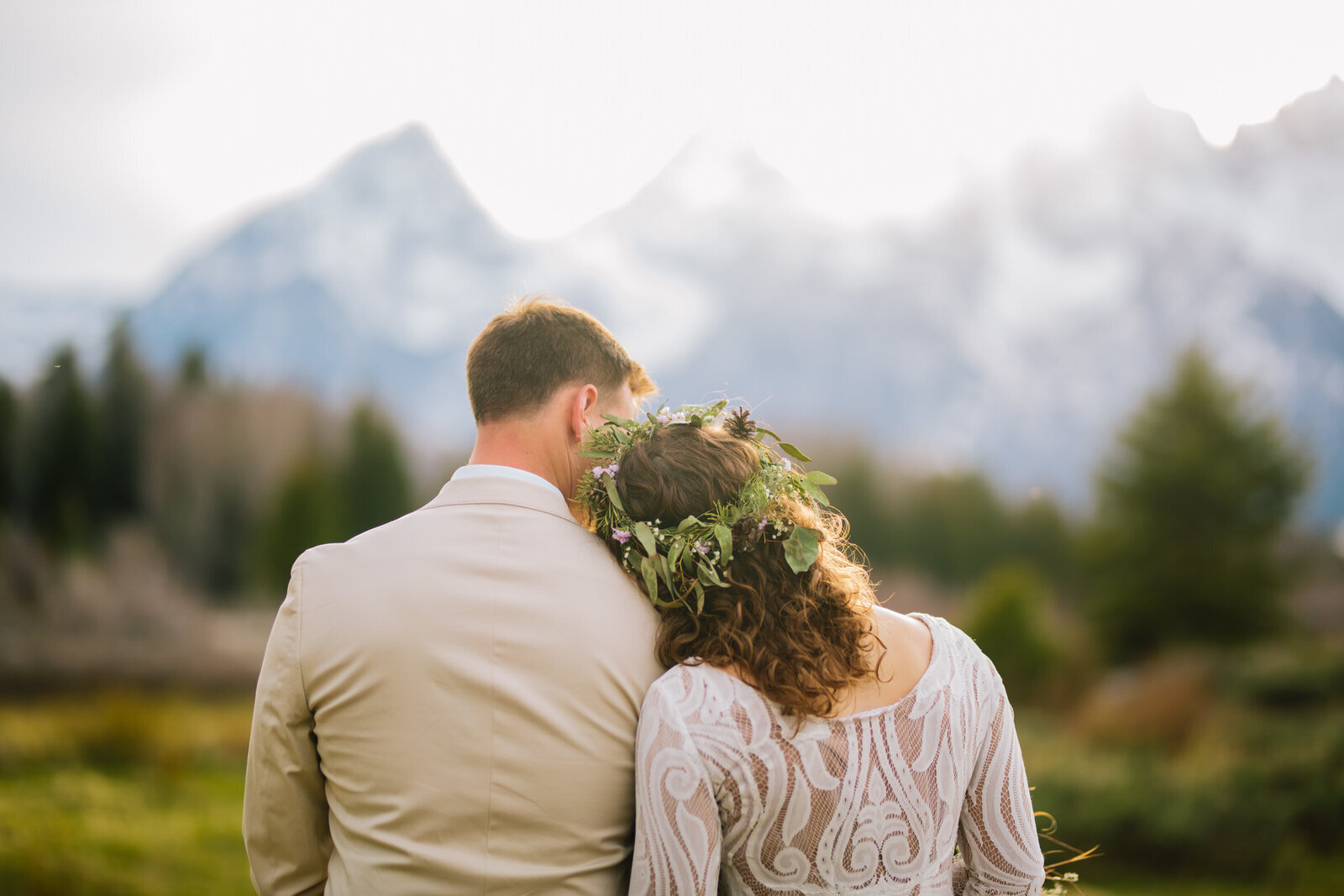 bride and groom embracing  in  Jackson Hole