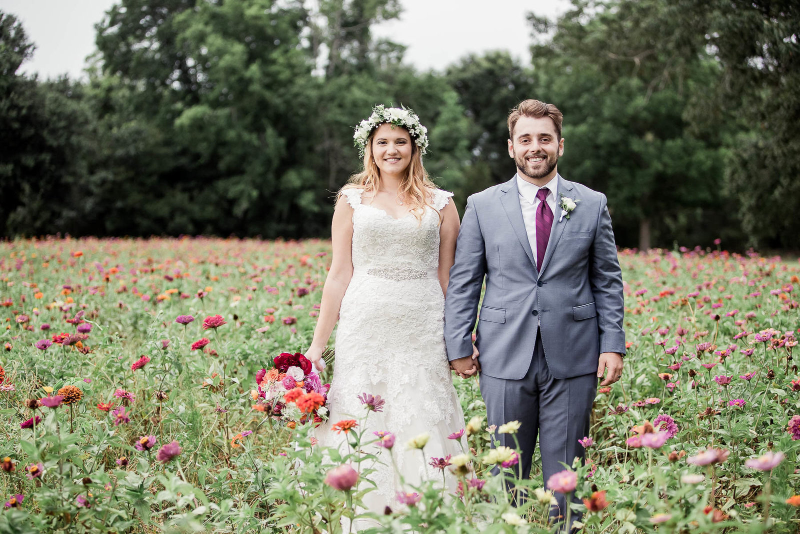 Bride and groom pose together in field, The Island House, Charleston, South Carolina