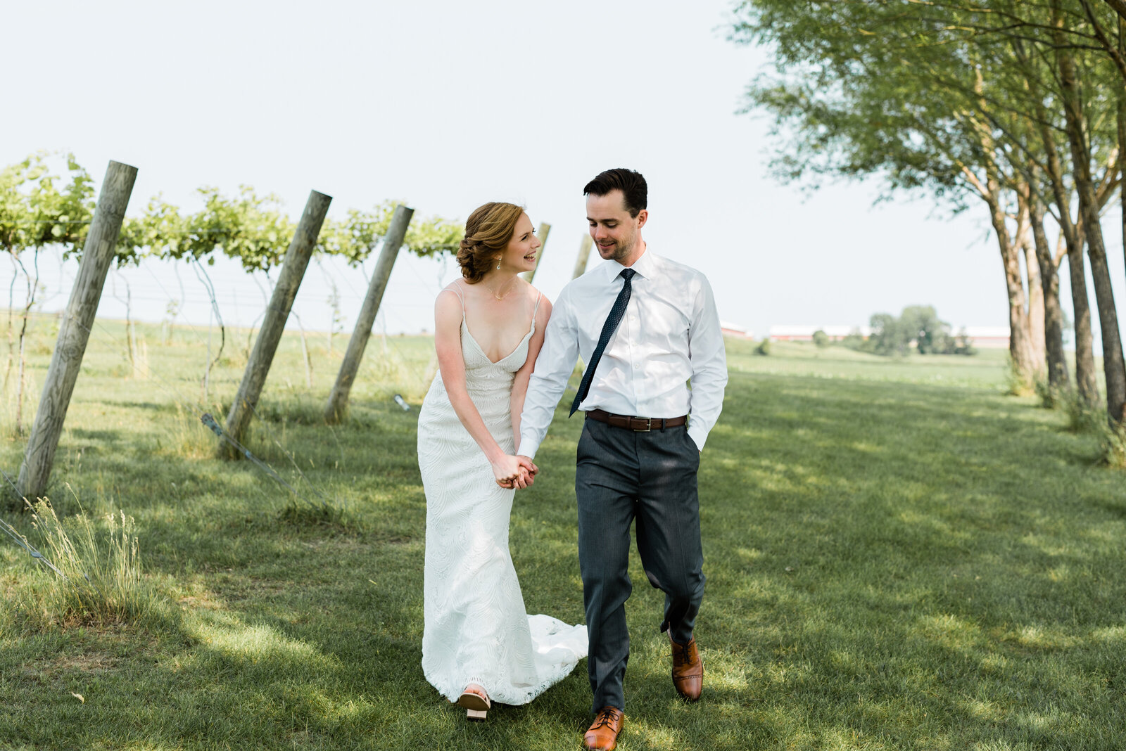 Bride and groom walking at Red Barn Farm in Northfield, MN