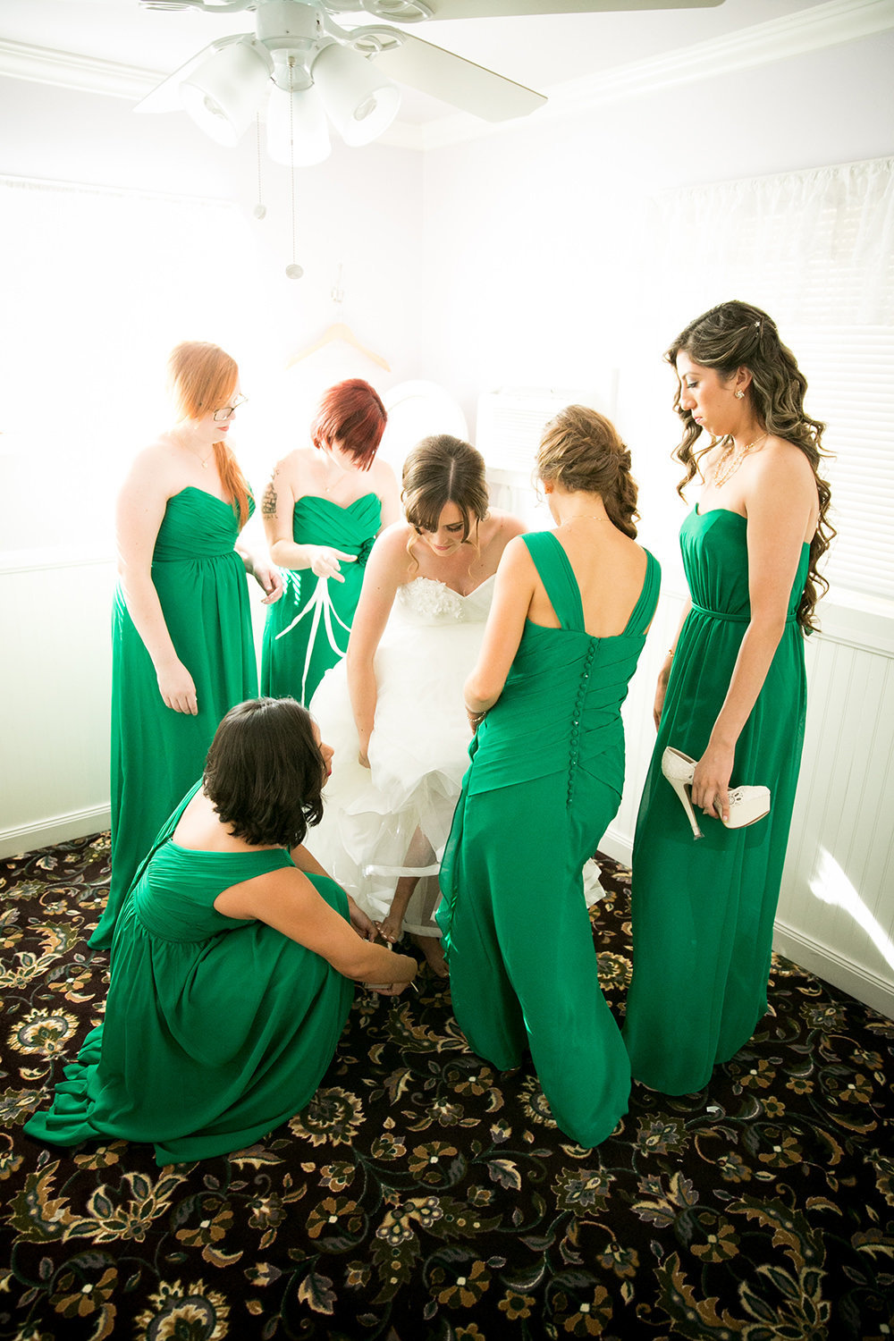 bride getting ready bridesmaids with green dresses