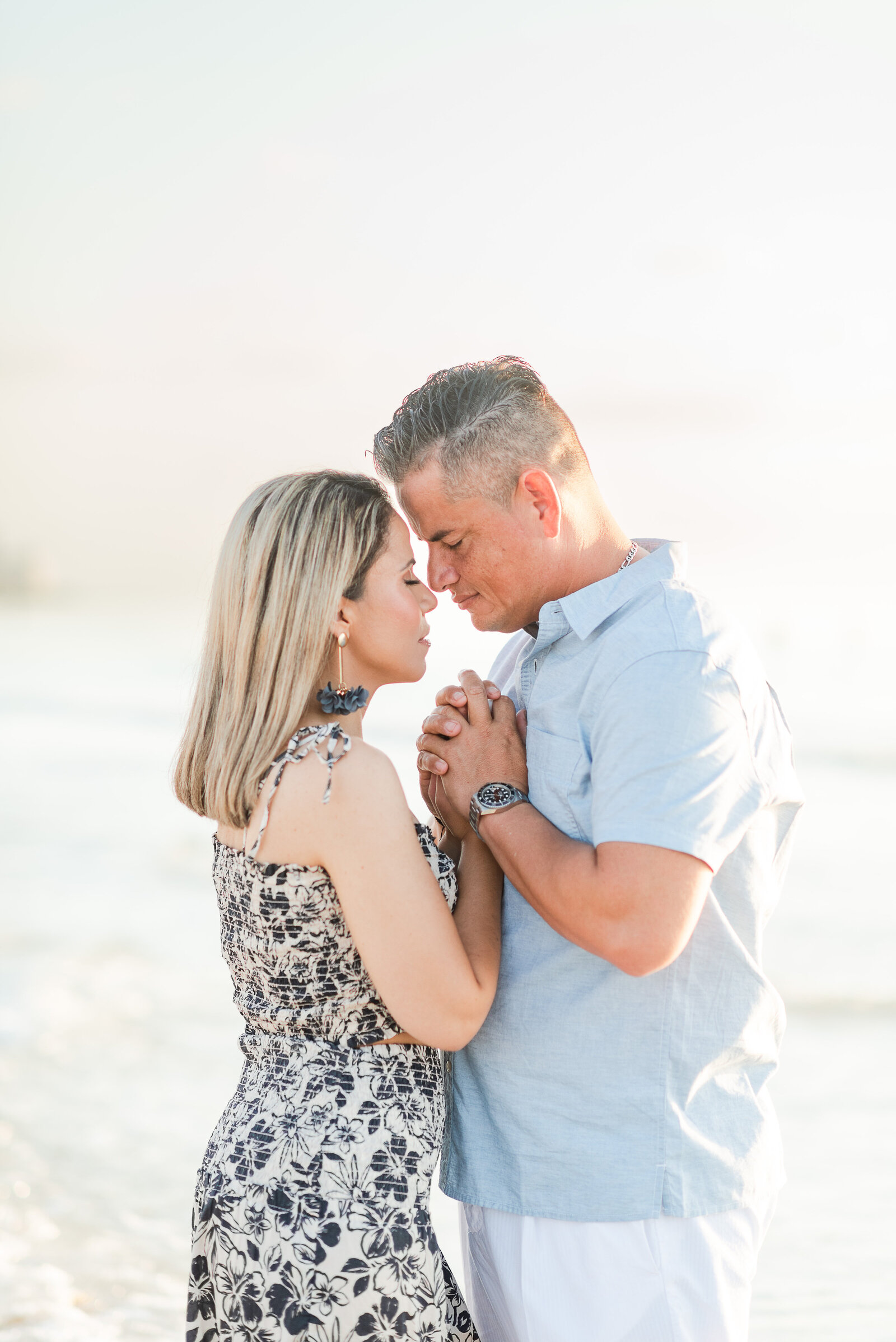 couple walking on the beach family session by Miami lifestyle  photographers David and Meivys MSP Photography