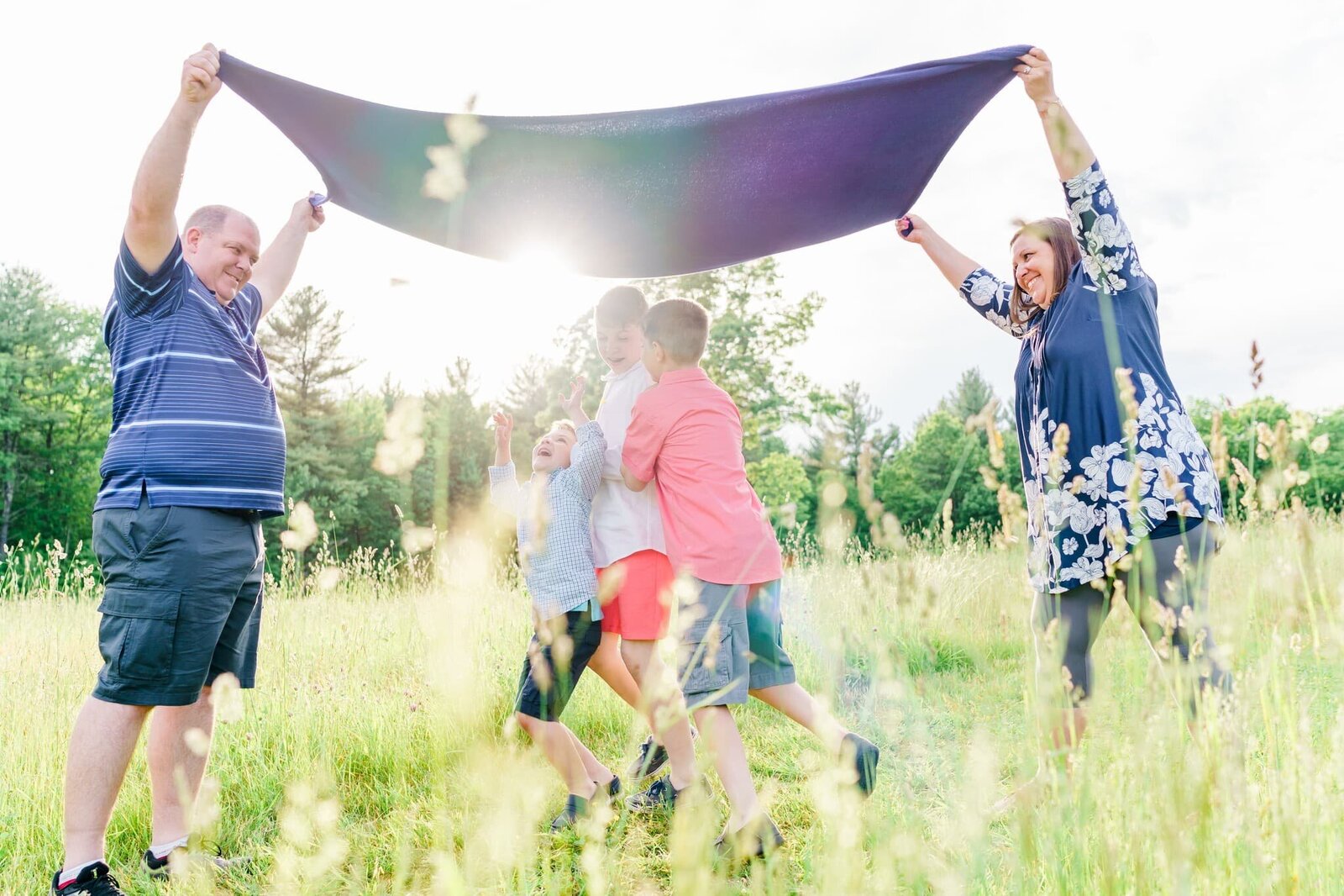 Blanket up in the air for family photos