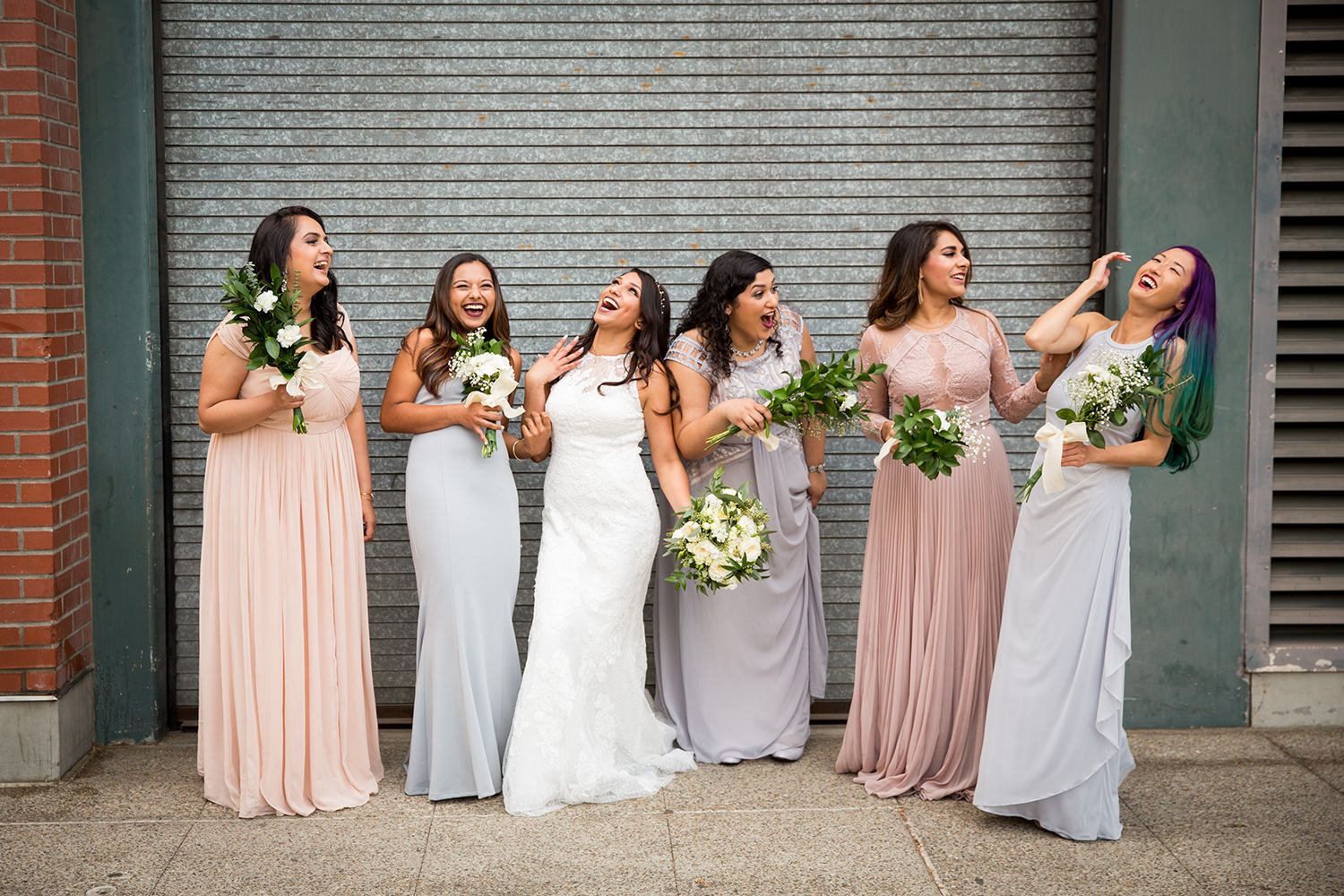 bride and bridesmaids downtown for luce loft wedding