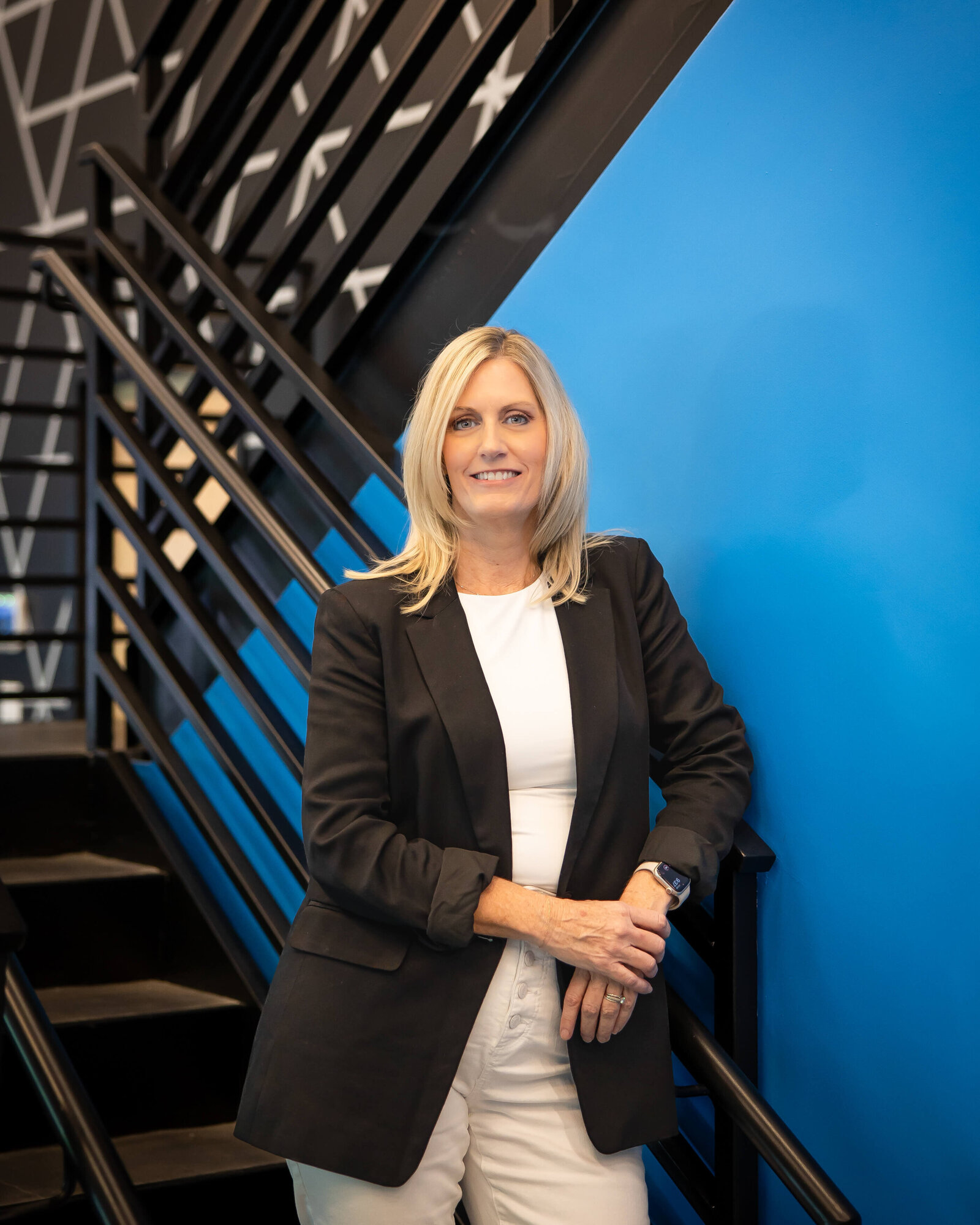 Personal branding photoshoot for an entrepreneur in Orlando, Florida. Office setting showcasing a confident individual engaged in work, reflecting leadership and innovation.