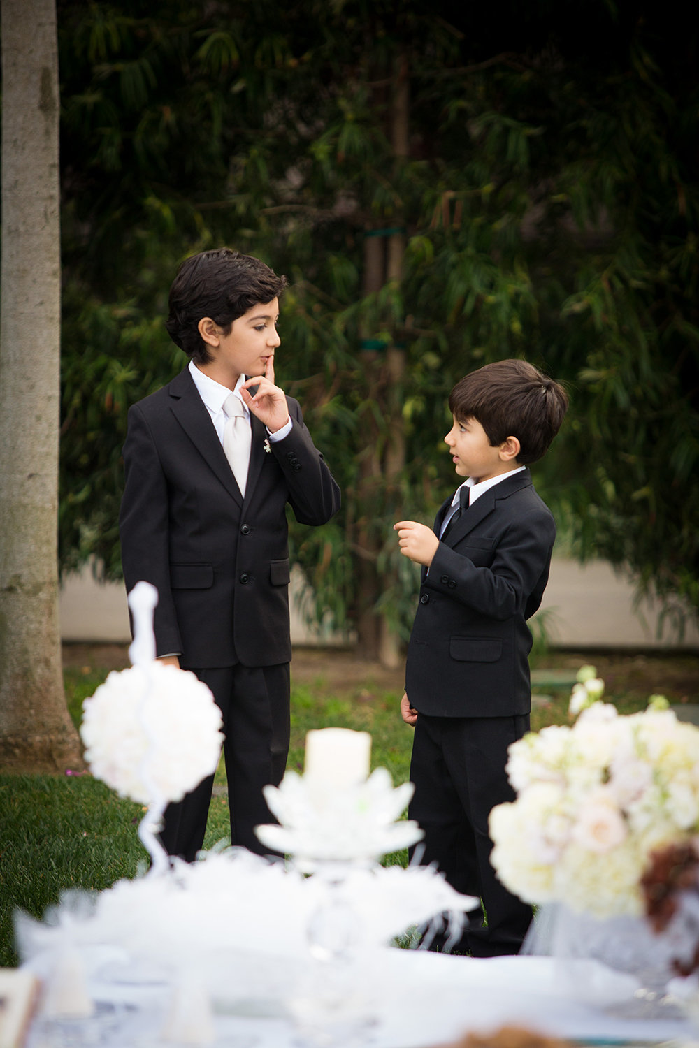 Ring bearers distracted during the wedding ceremony