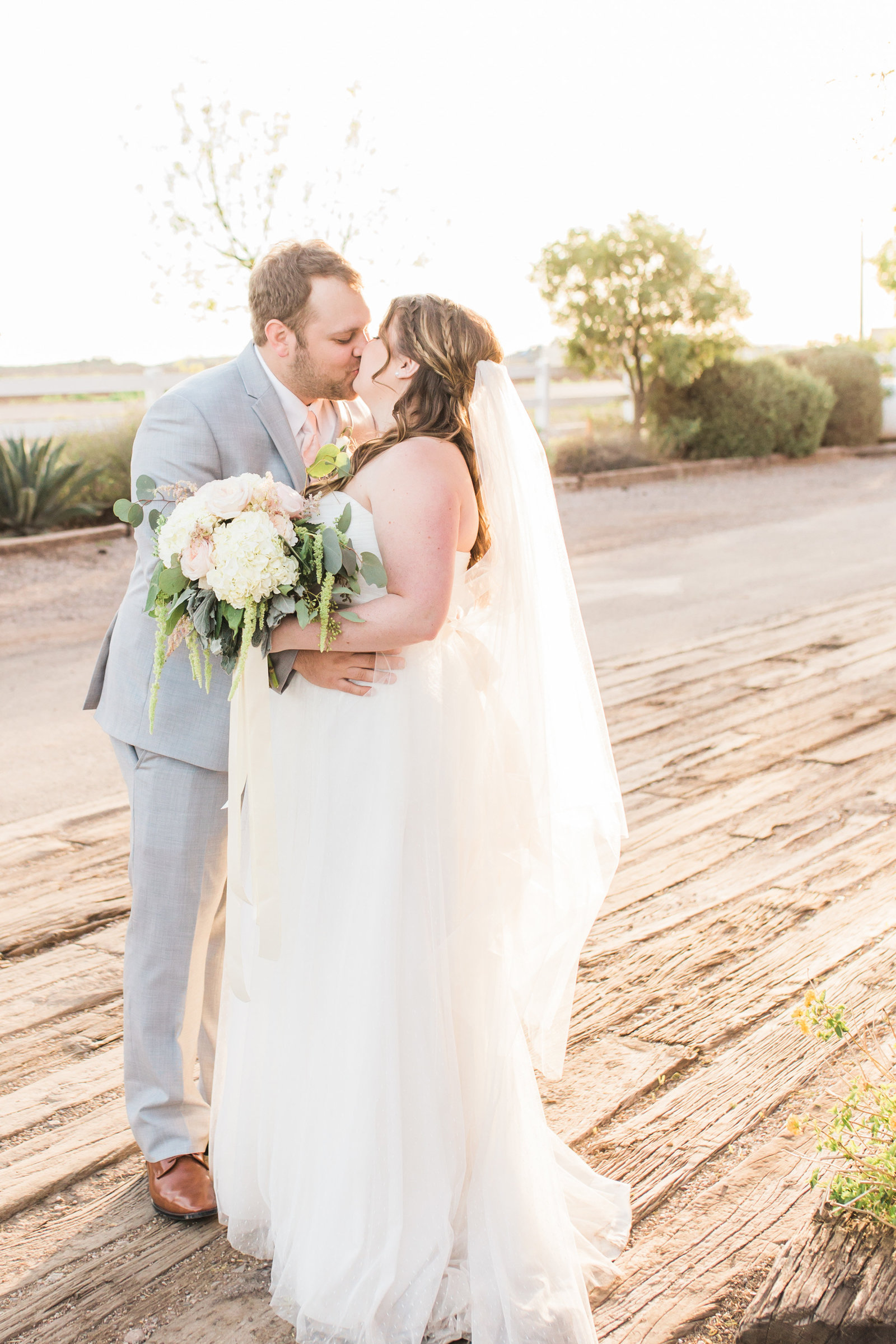 Florence Windmill Winery Rustic Elegant Wedding Photo with Bride and Groom Kissing | Tucson Wedding Photographer | West End Photography