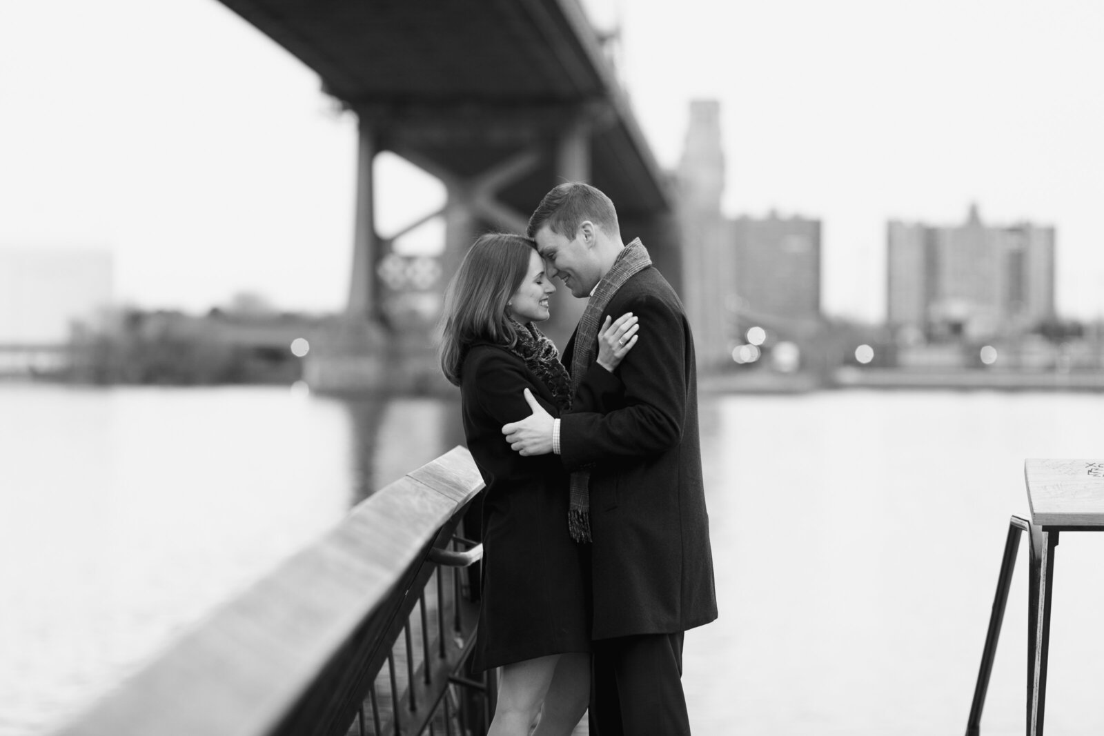 engaged couple ben franklin bridge