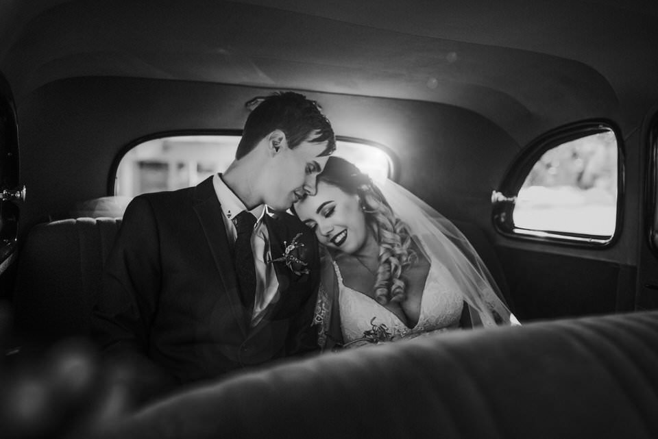 Bride and Groom in wedding car
