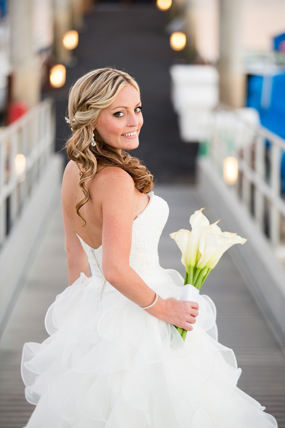 stunning bride on dock at catamaran