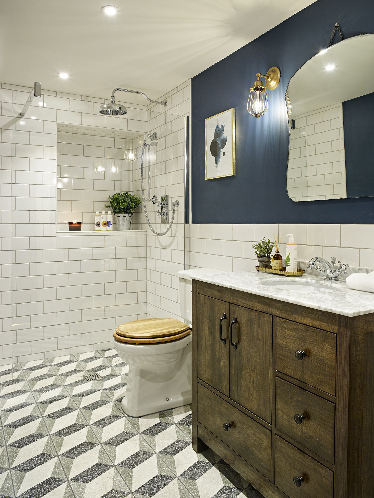 luxury bath room with tile shower and navy wall