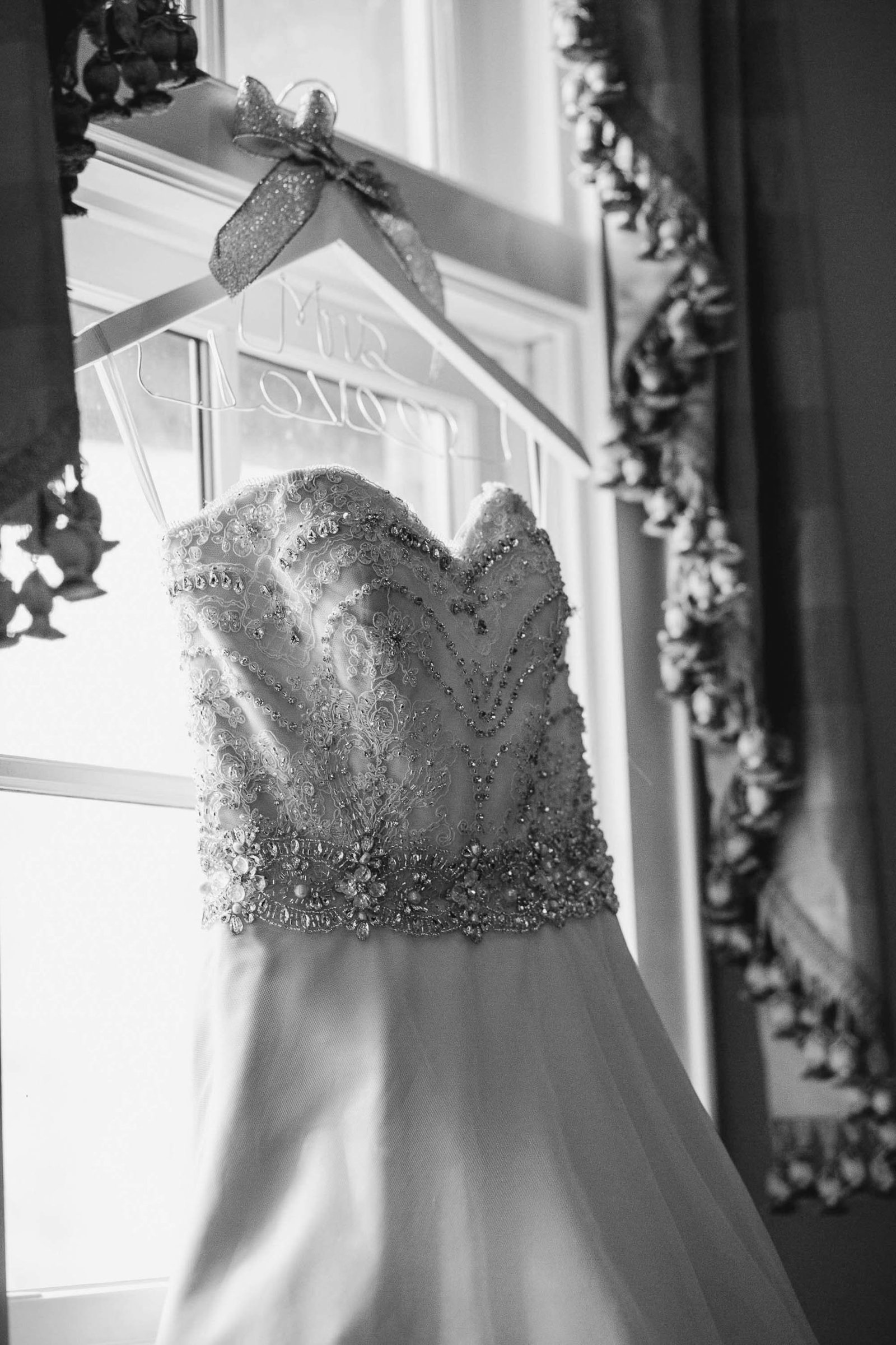 Wedding dress hangs on custom hanger, Brookgreen Gardens, Murrells Inlet Wedding Photography.