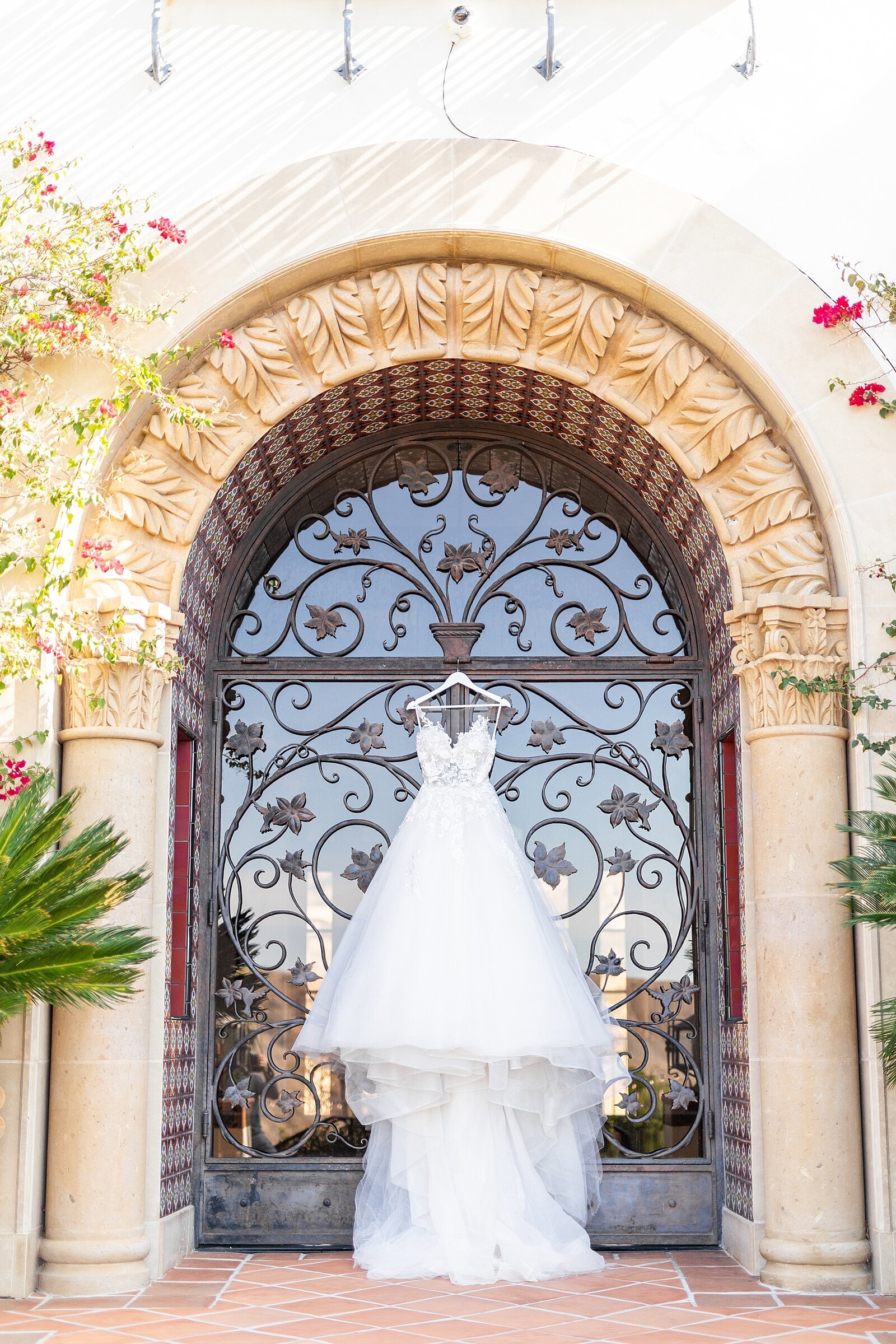 Bride's wedding gown hanging at Hummingbird Nest Wedding Venue in Santa Susana, California. | Sherr Weddings