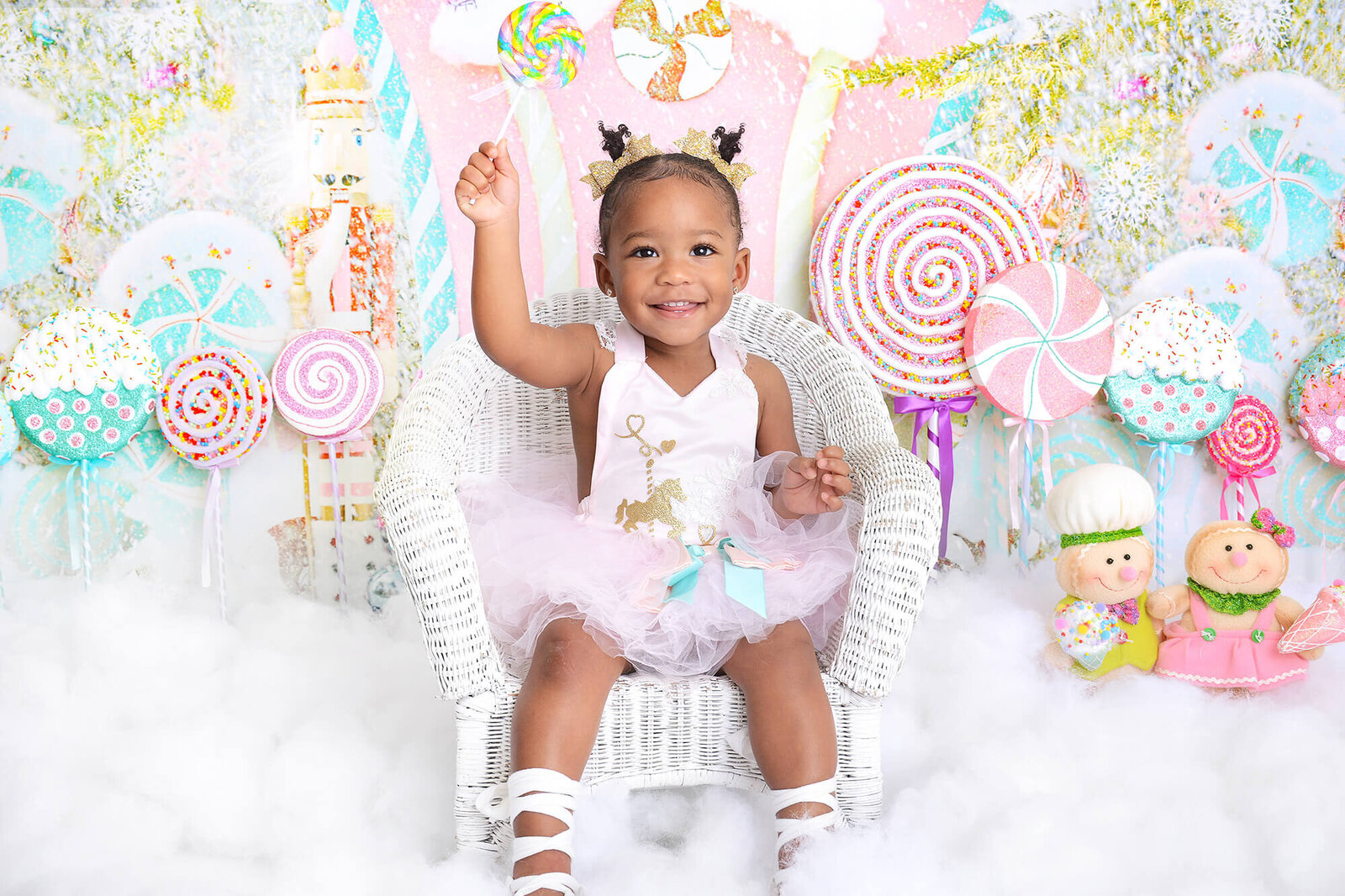 girl smiles at her candy themed birthday photoshoot in houston
