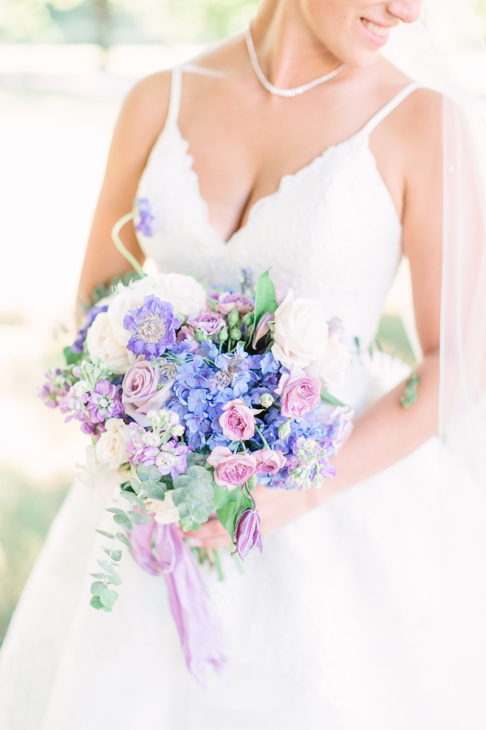 neufield bride holding bouquet