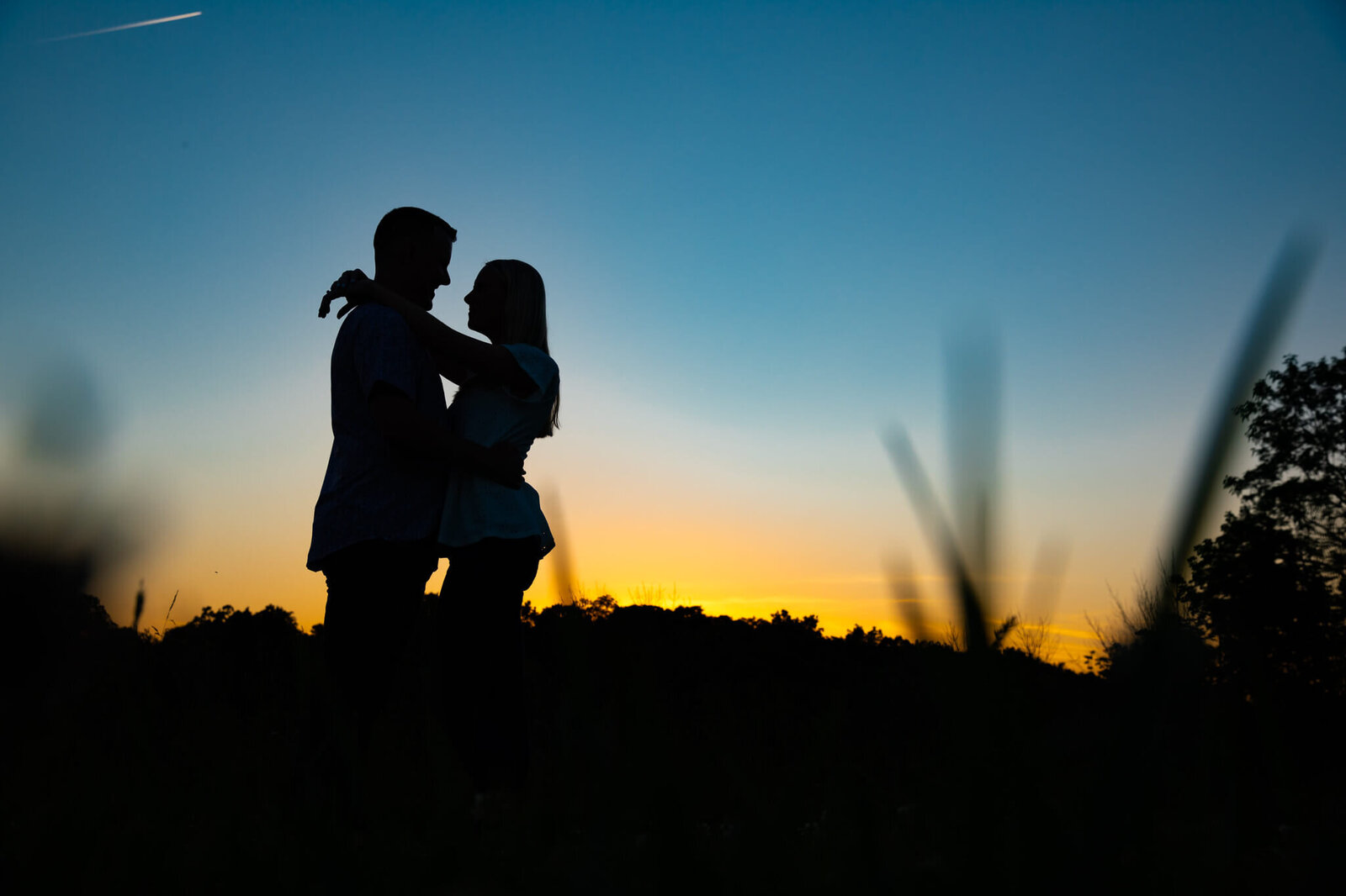 sunset-romantic-engagement-session-farm-silhouette