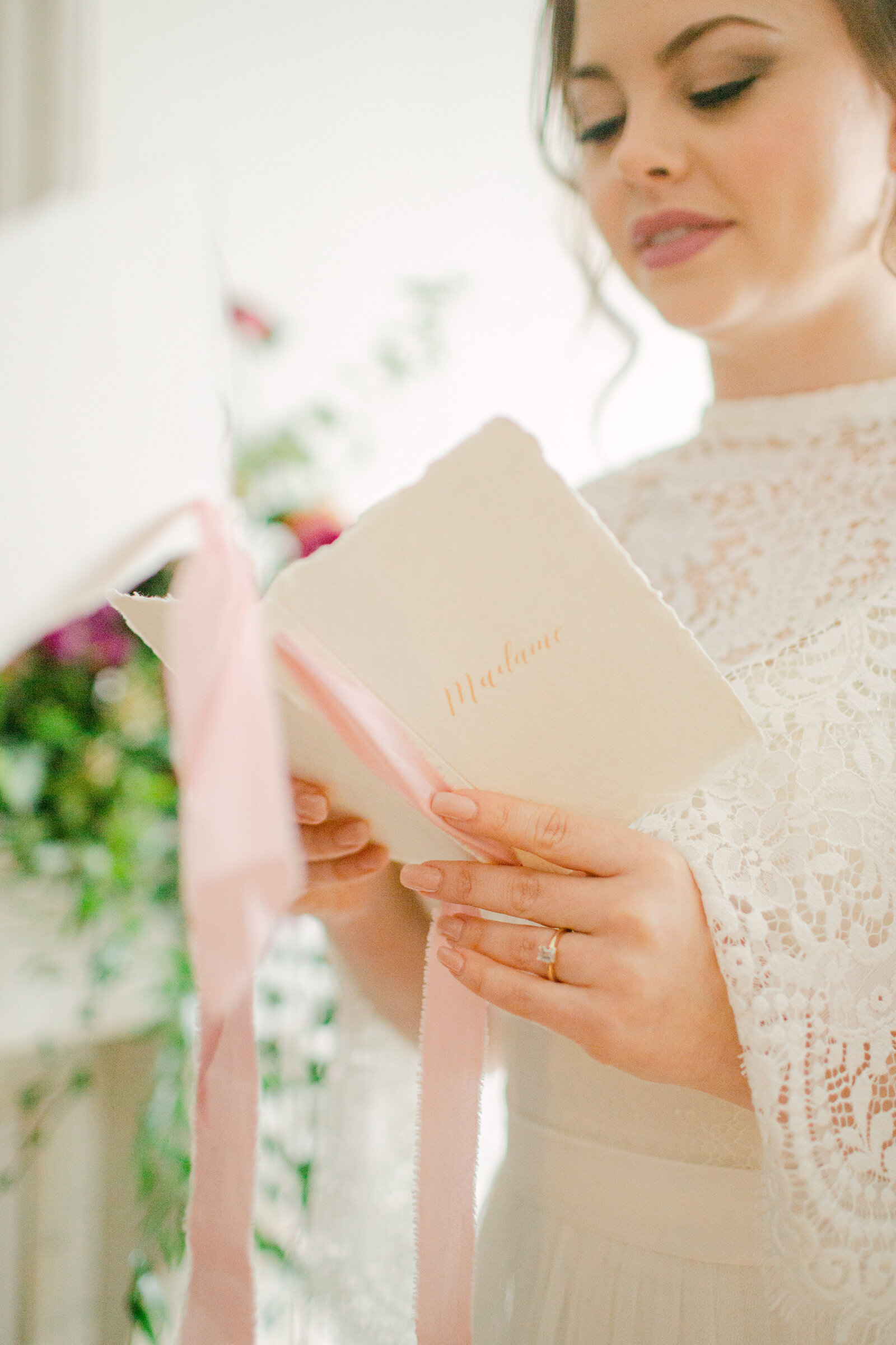 bride facing groom holding vow book and exchanging her vows