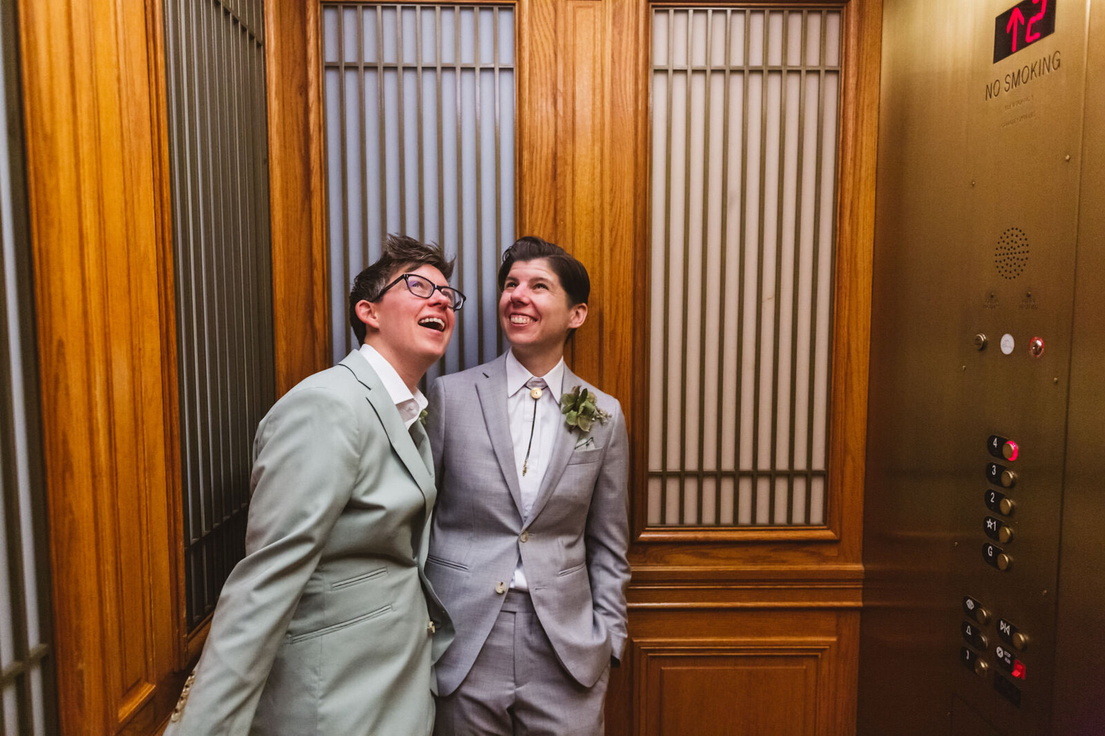 queer couple in elevator at SF City Hall
