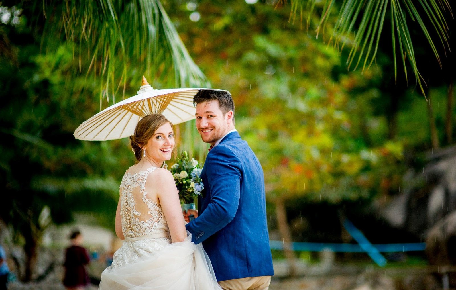 Bride and Groom under parasol