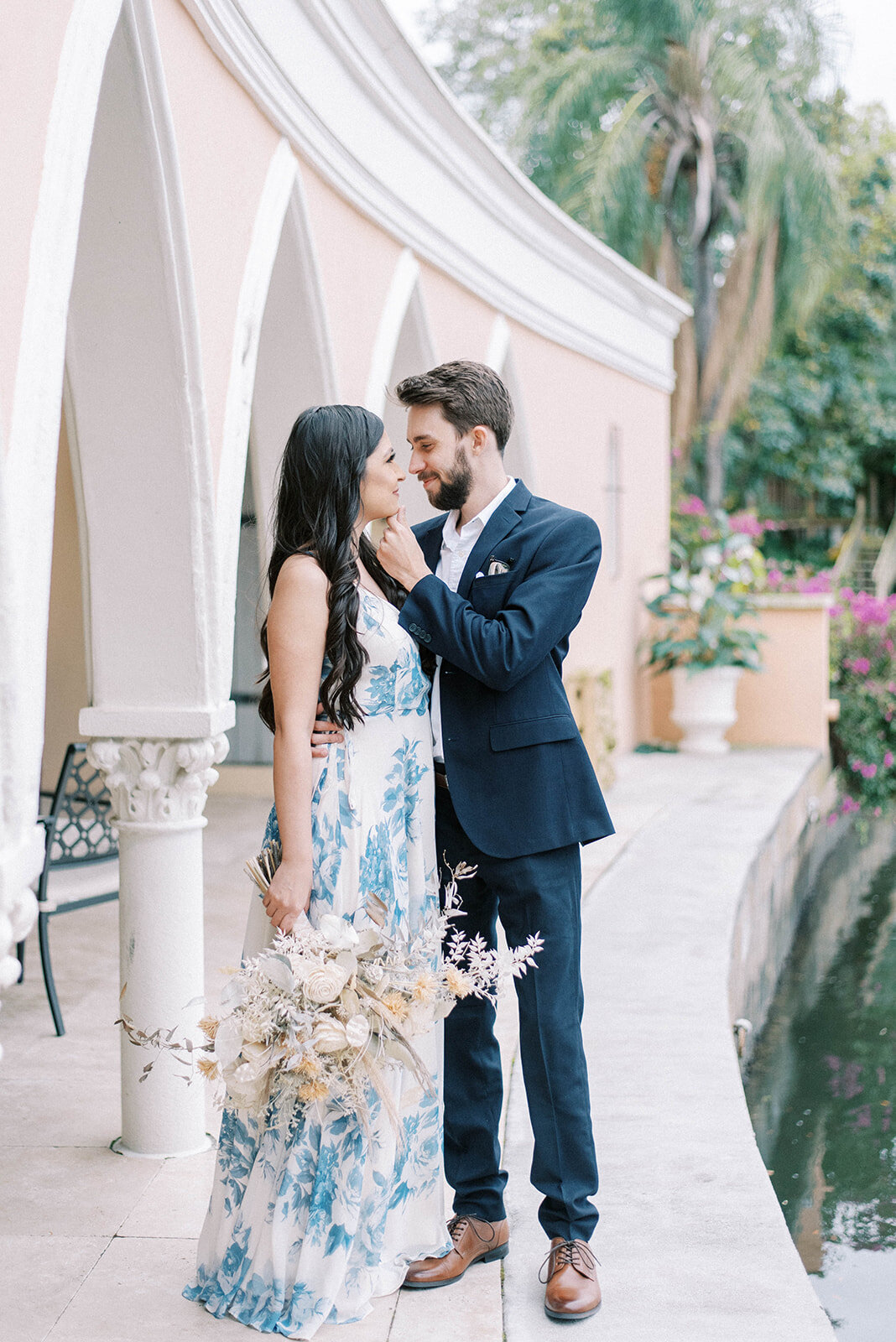 couple hugging during outdoor engagement session in Florida