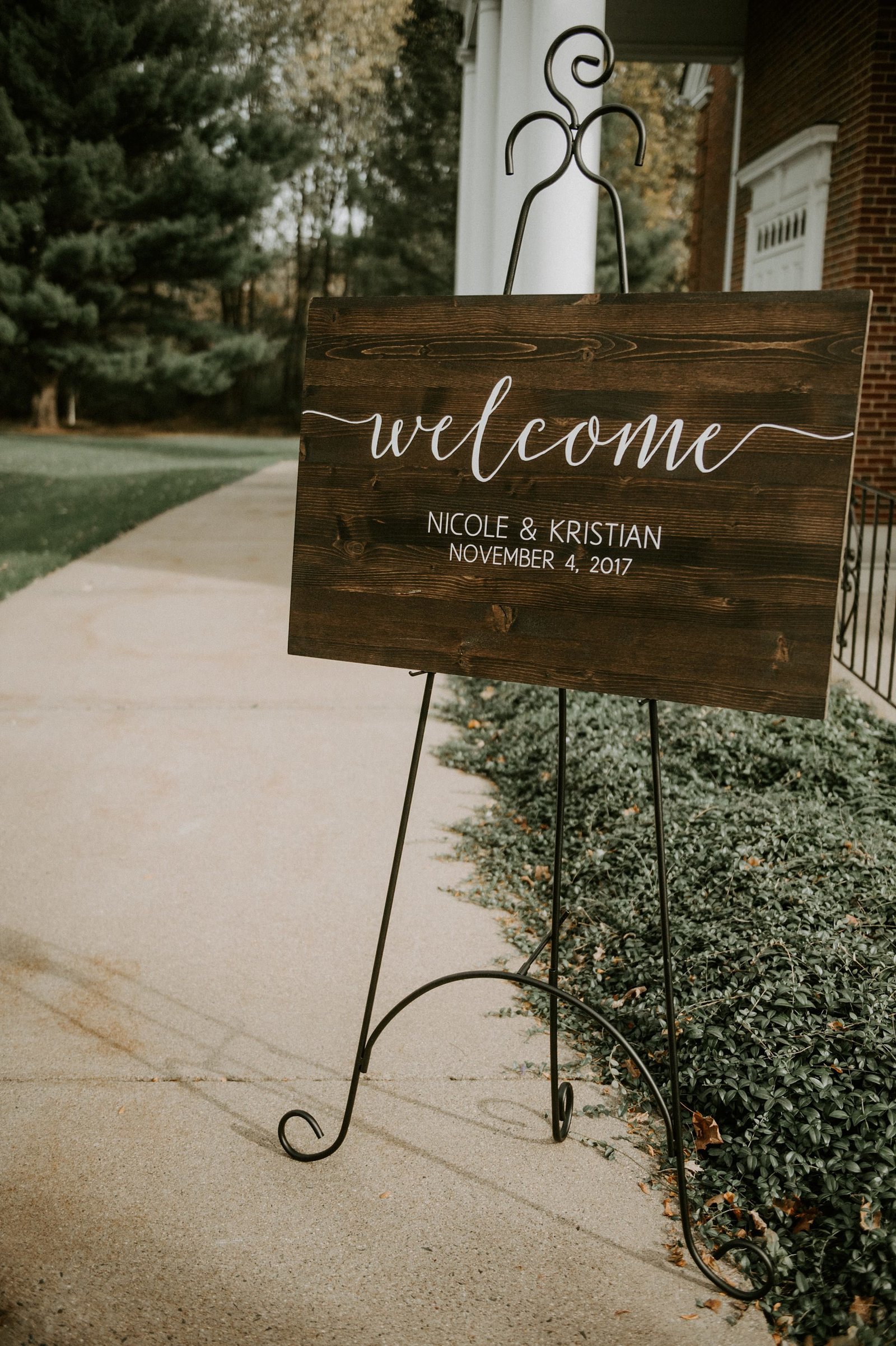 Rustic wooden ceremony welcome sign for wedding at The Webb Barn in Wethersfield, CT