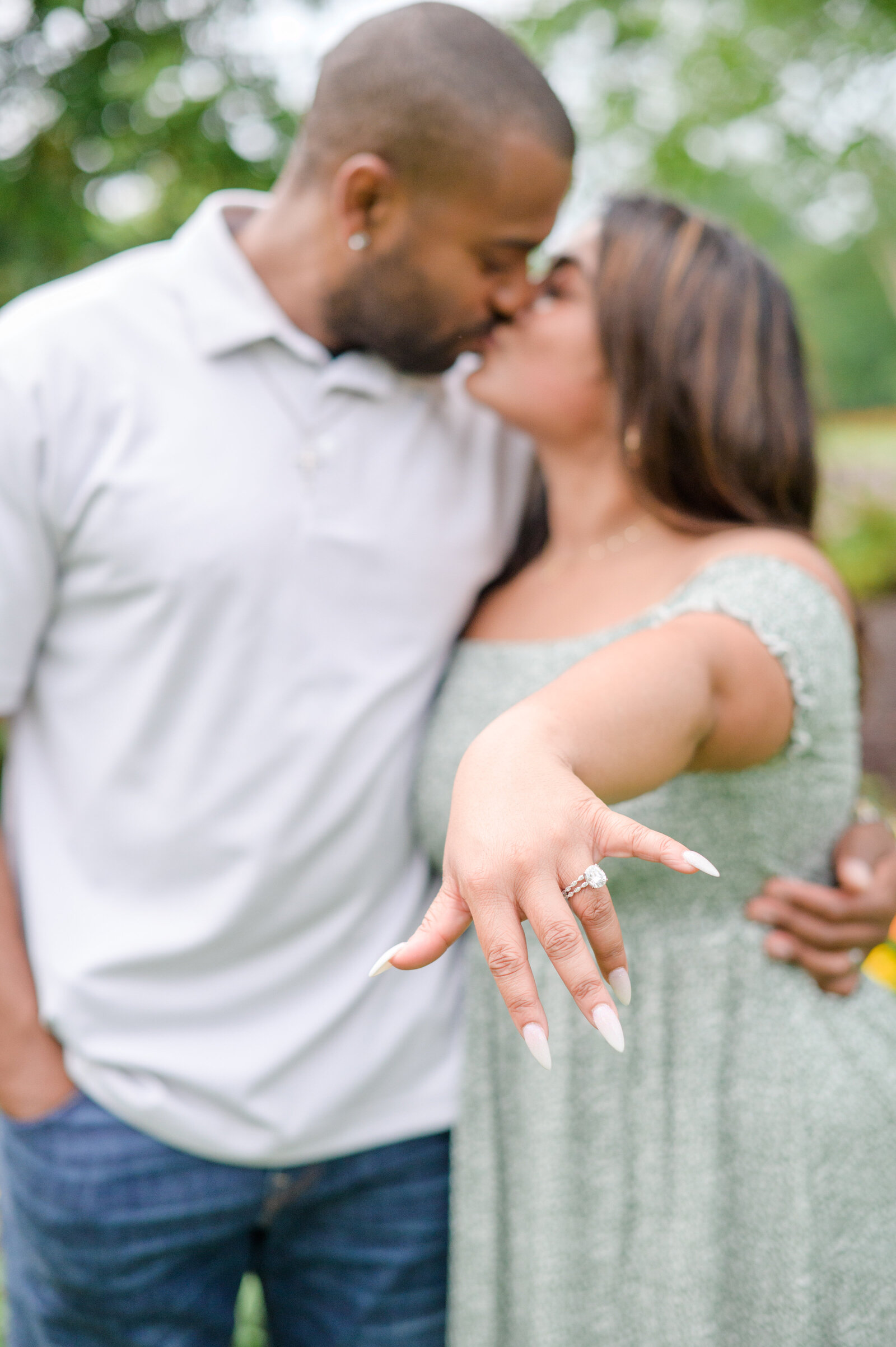 Couple holds out brand new engagement ring during surprise proposal photographed by baltimore maryland wedding photographer
