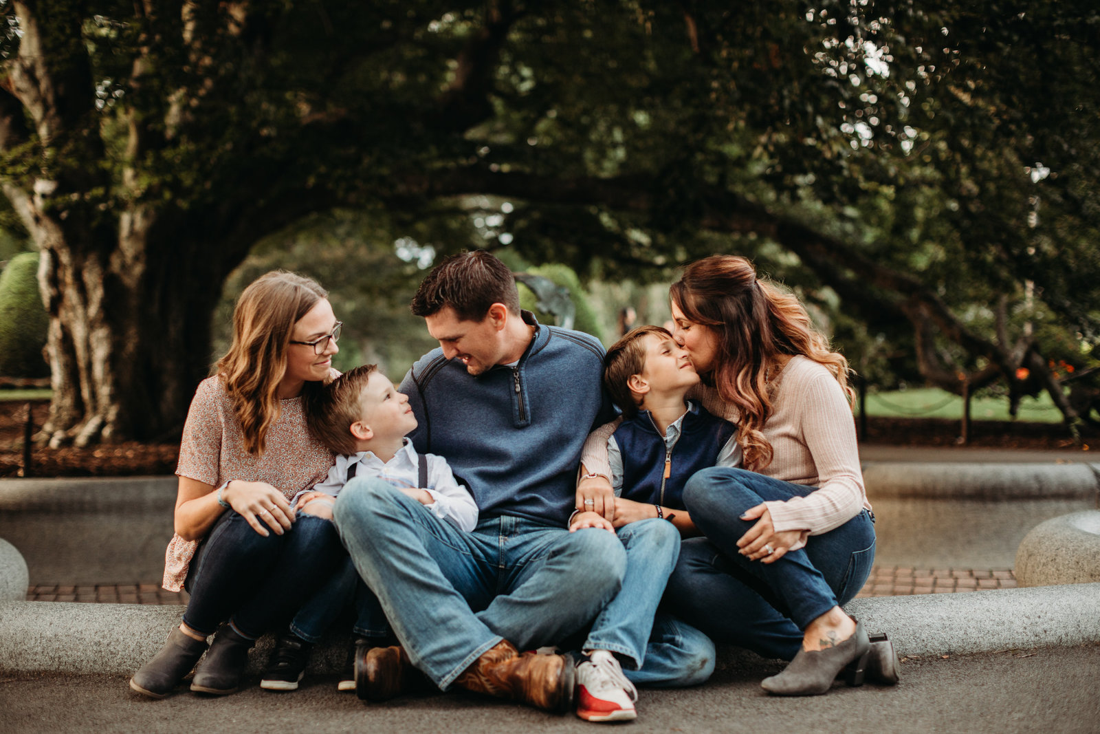 family of five snuggles close in downtown boston for photo shoot
