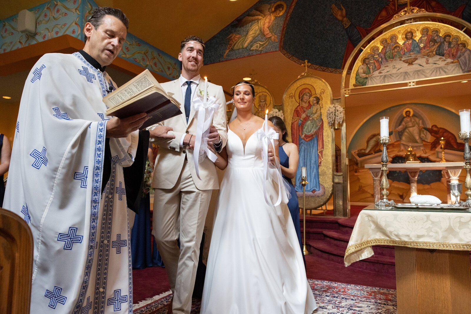 couple in traditional greek wedding service