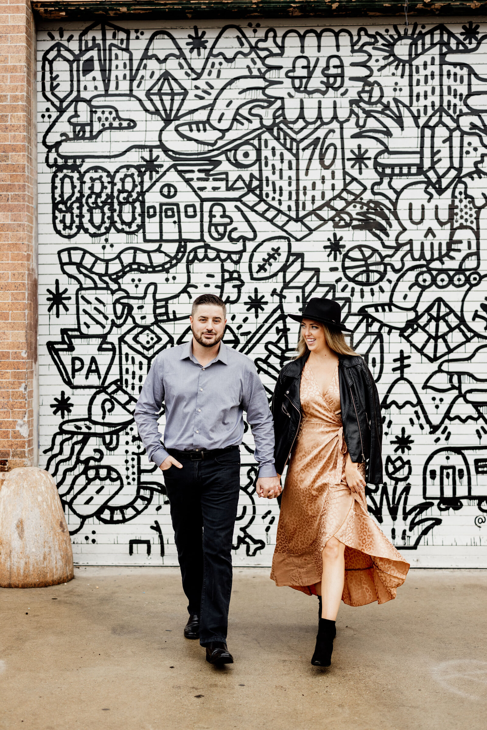 couple at colorful city mural