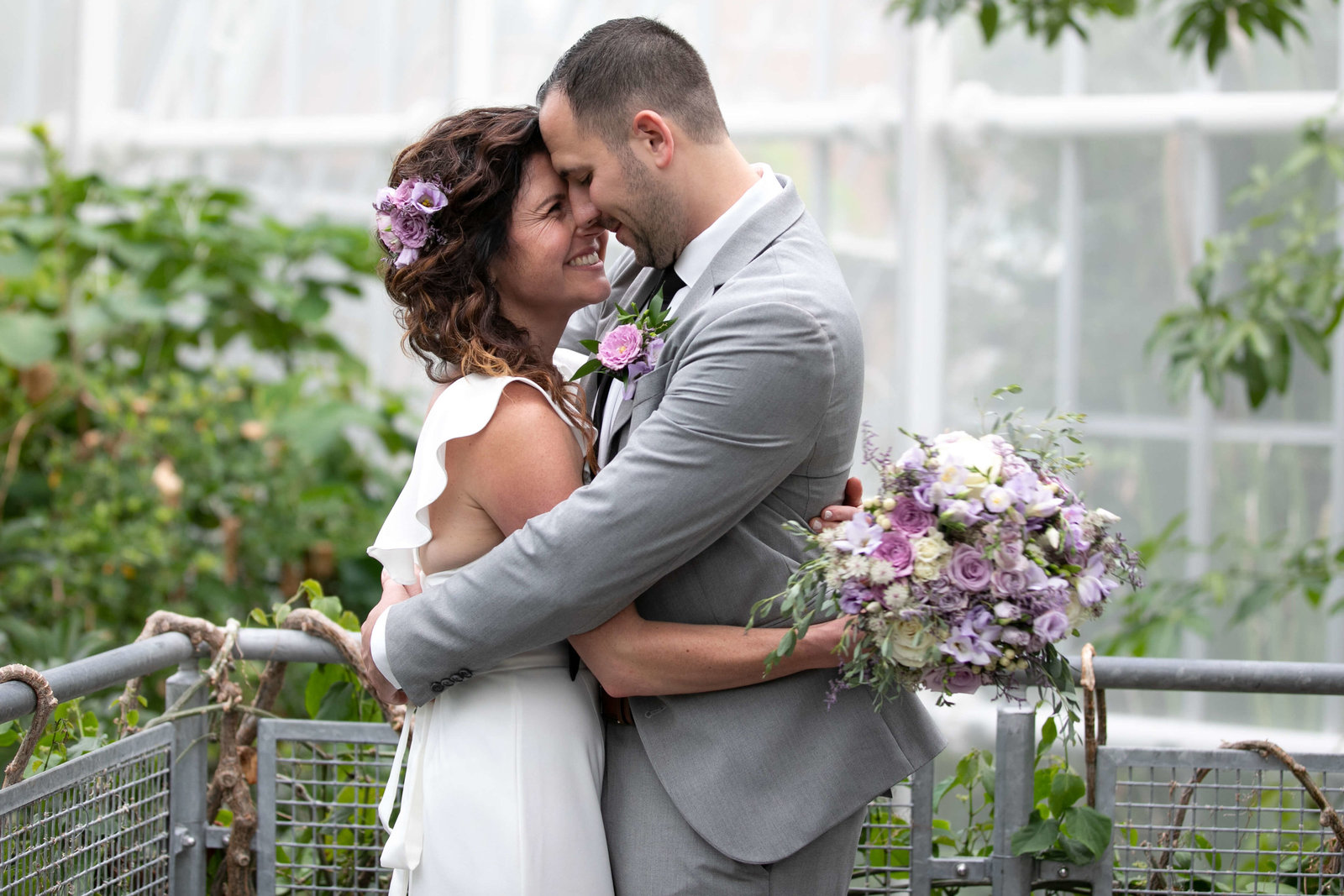 bride and groom in Ohio green house