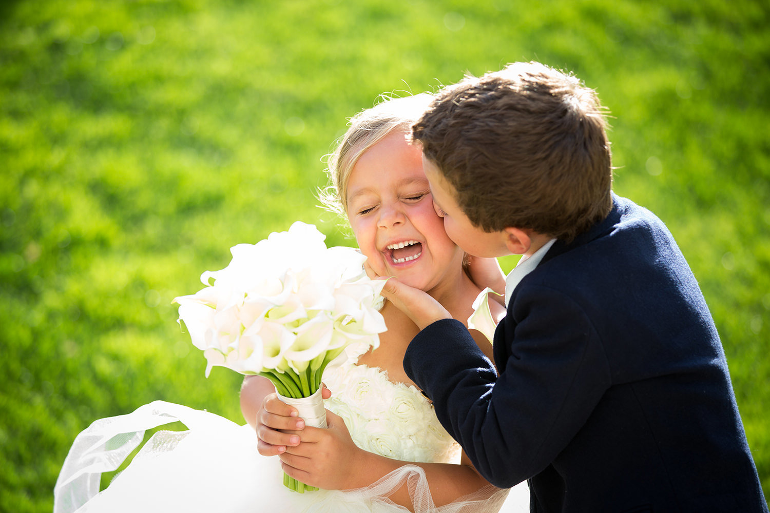 Sweet moment between the flower girl and ring bearer
