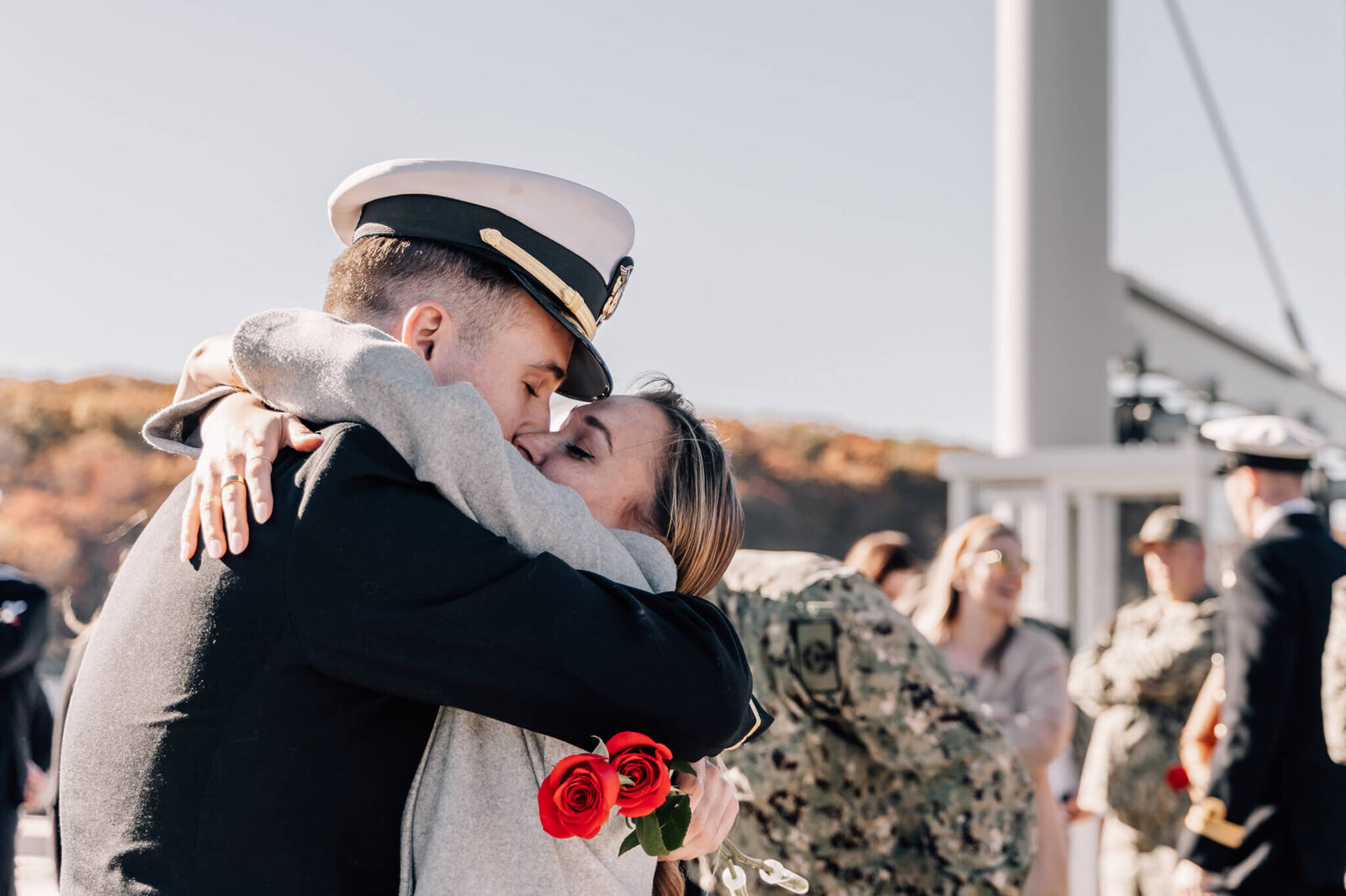 Naval officer reunites with partner at USS North Dakota homecoming..