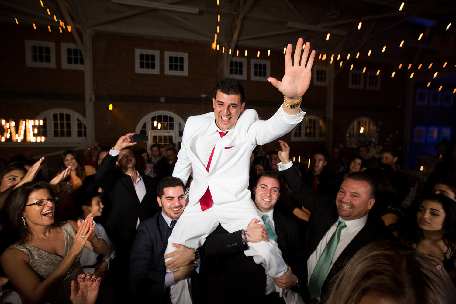 Groom flying high at the wedding reception