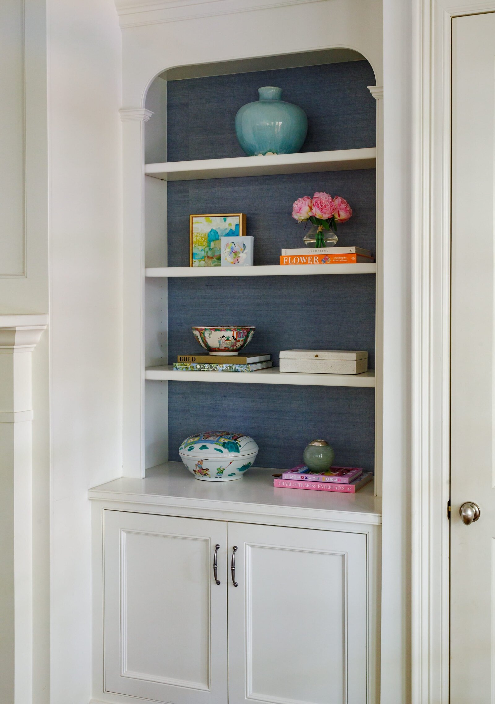 vision and hammer styling shelf with blue wallpaper and pink flowers
