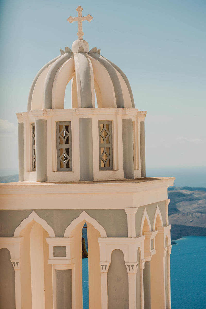 Grey and white Bell Tower in Fira, Santorini Island, Greece