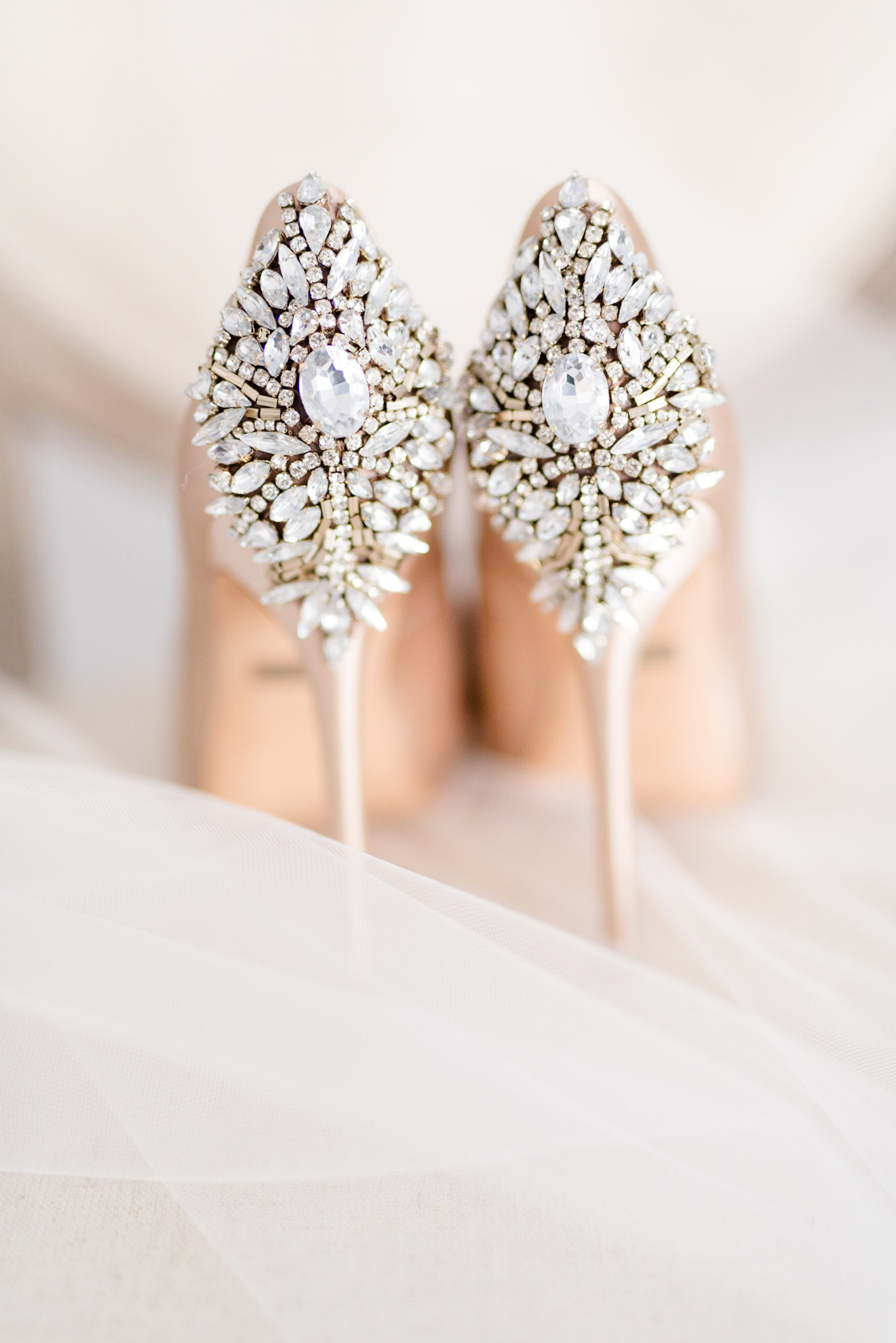 Jeweled bridal shoes sit on chair in Tampa.