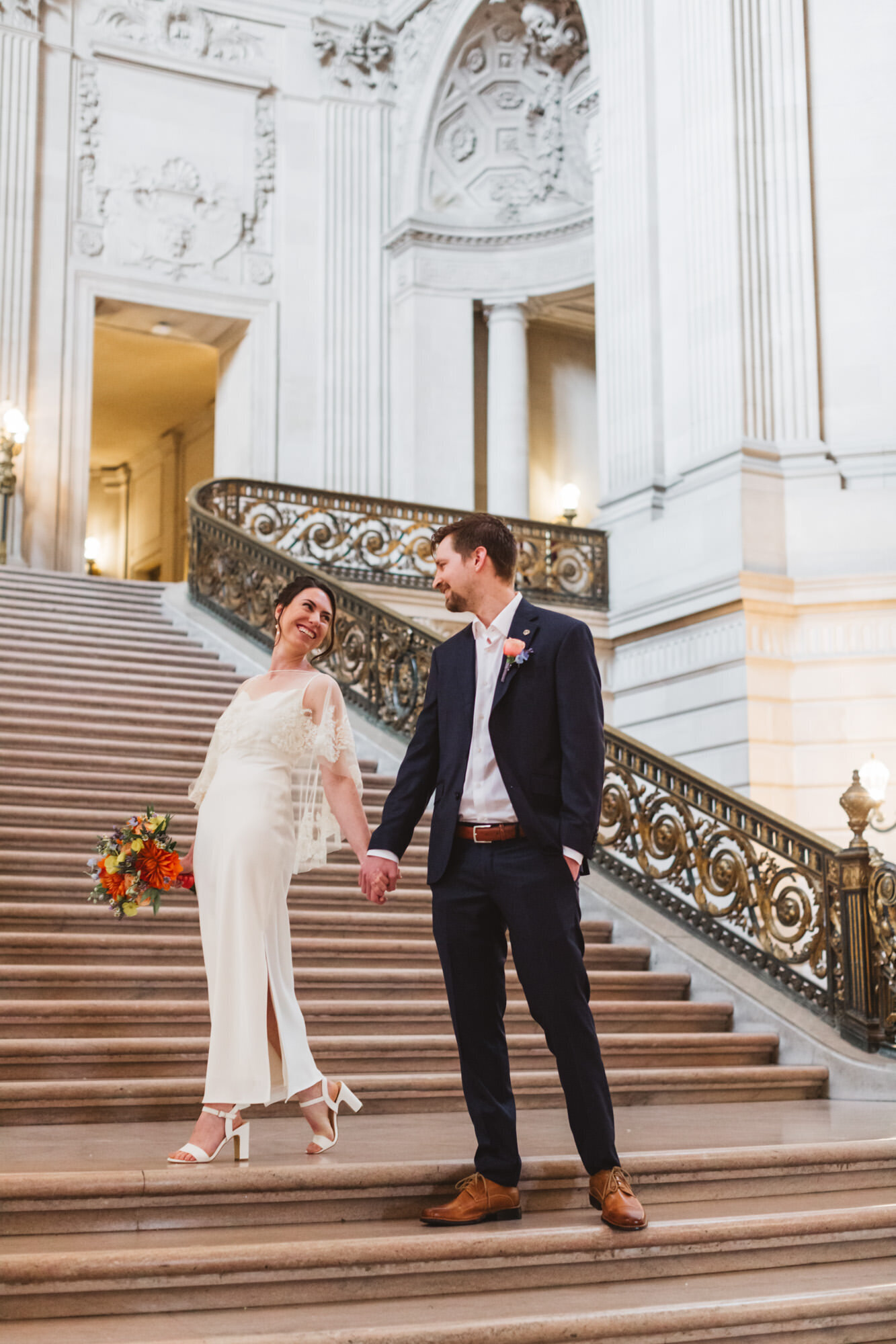 bride and groom candid and poignant Grand Staircase