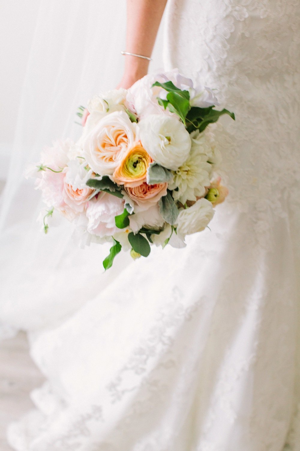Gorgeous spring bridal bouquet in ivory, yellow and blush for Belle Mer Wedding