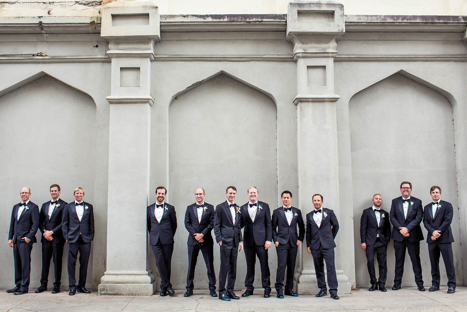 Groom and groomsmen stand in row, Grand Bohemian, Charleston, South Carolina