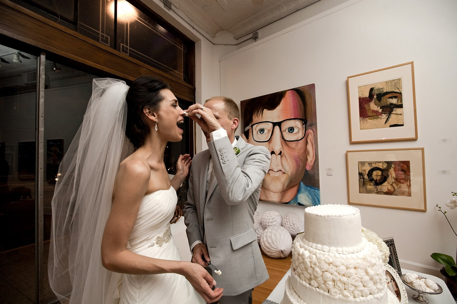 Couple cuts the cake at their Jacoby Arts Center wedding in Alton IL