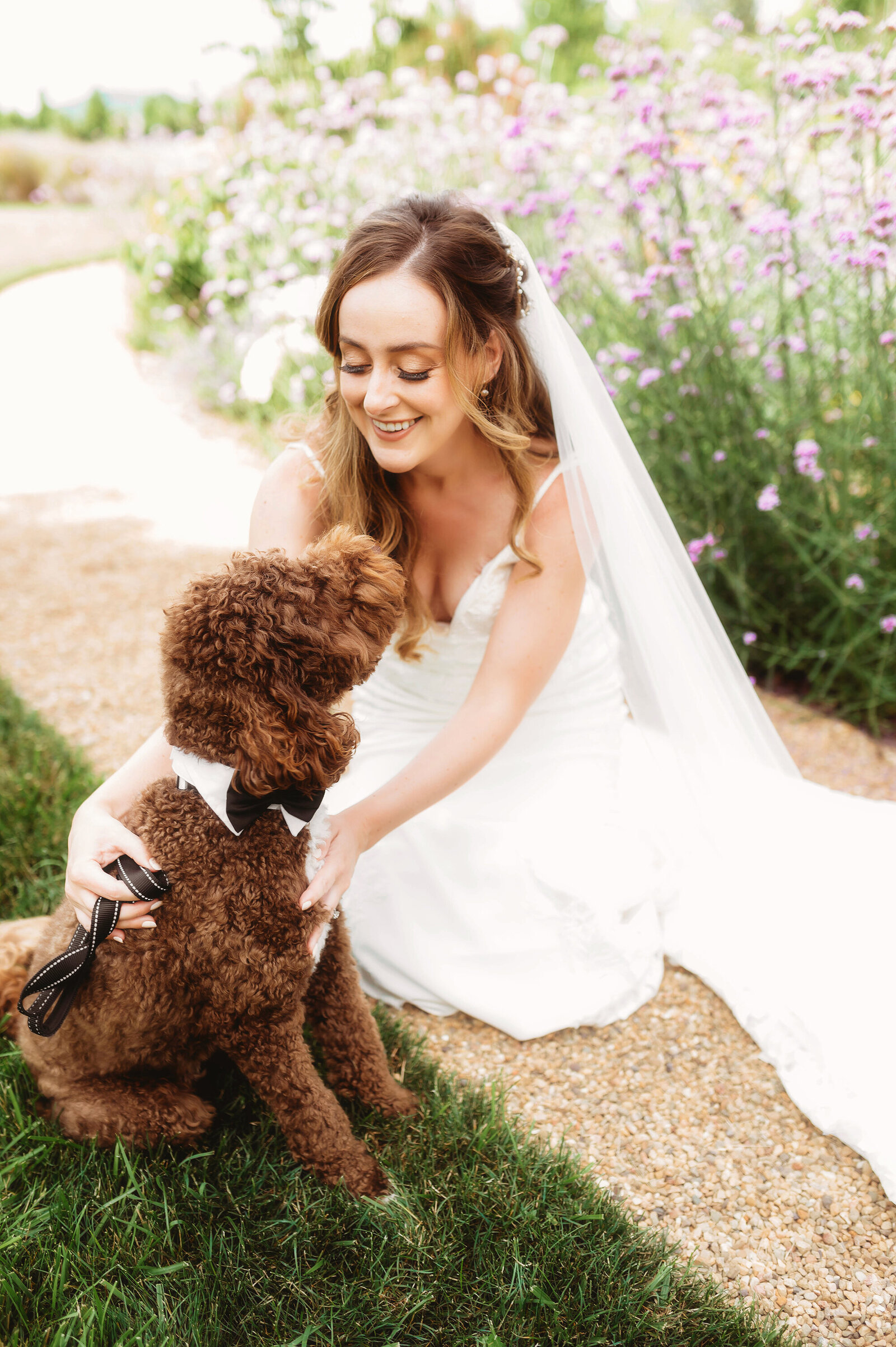 Bride kisses her puppy before her Micro-Wedding Ceremony at The Farm in Asheville, NC.