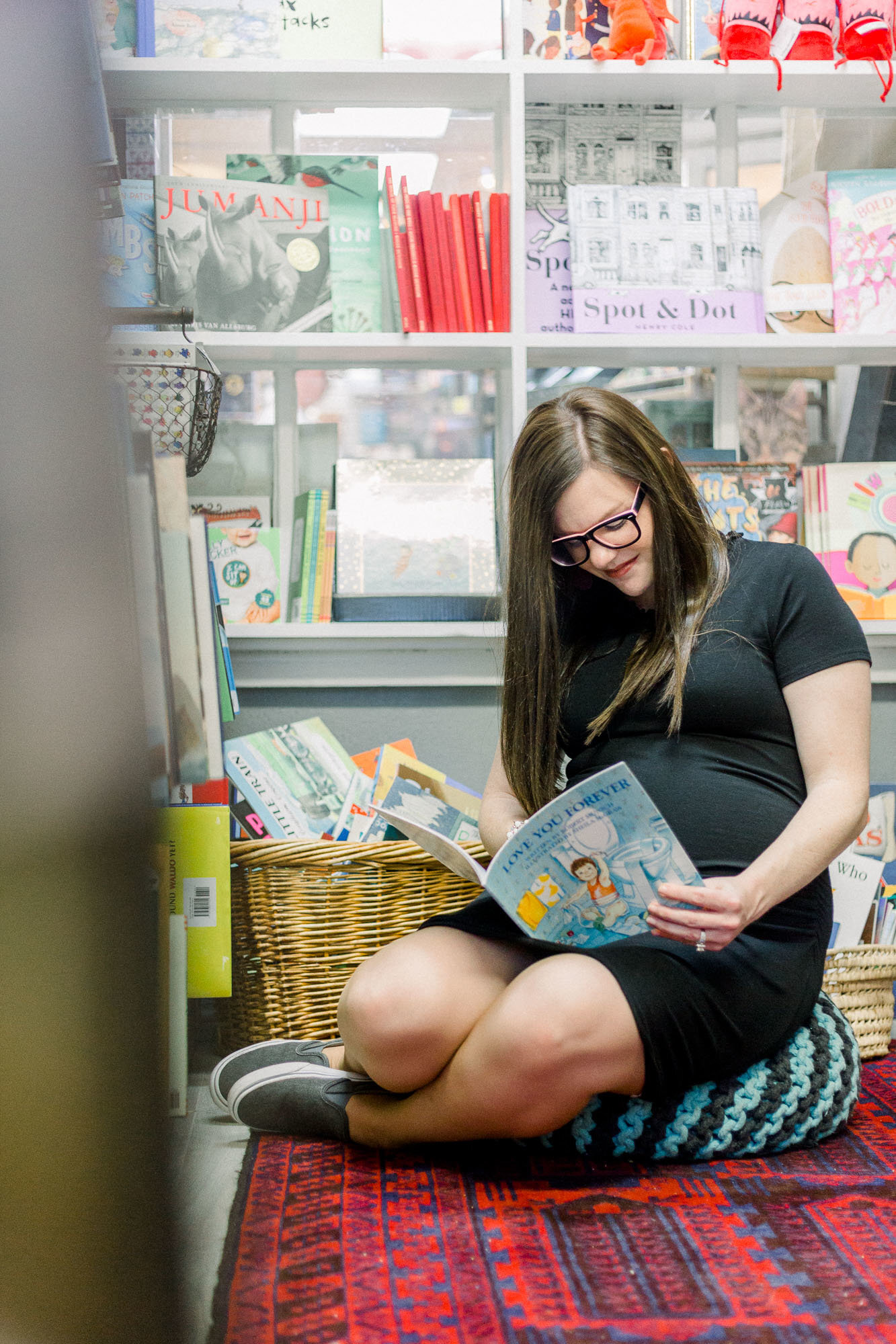Maternity book store session captured by Staci Addison Photography